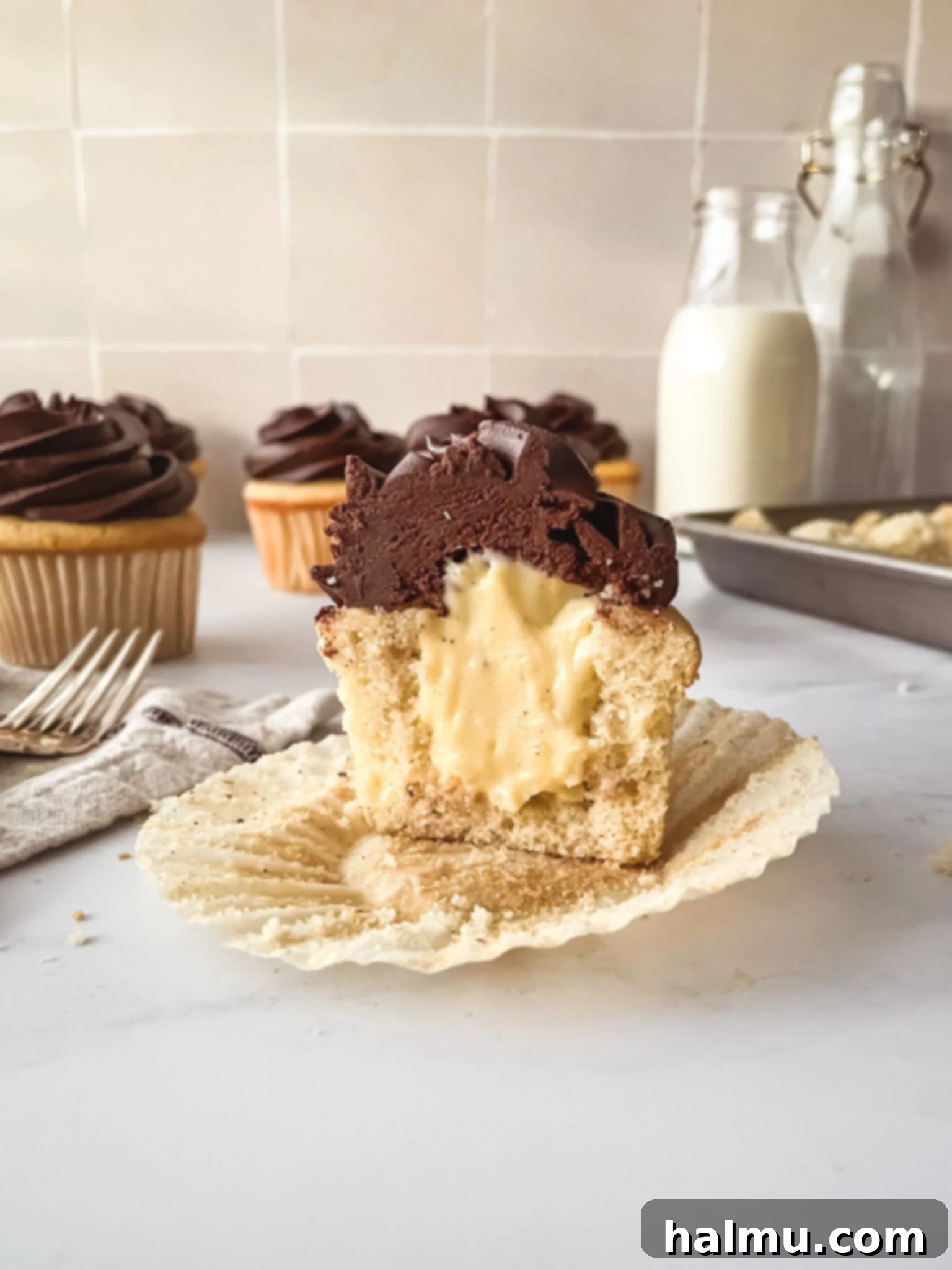 Delicious Boston Cream Cupcakes with vanilla cake, pastry cream, and chocolate ganache