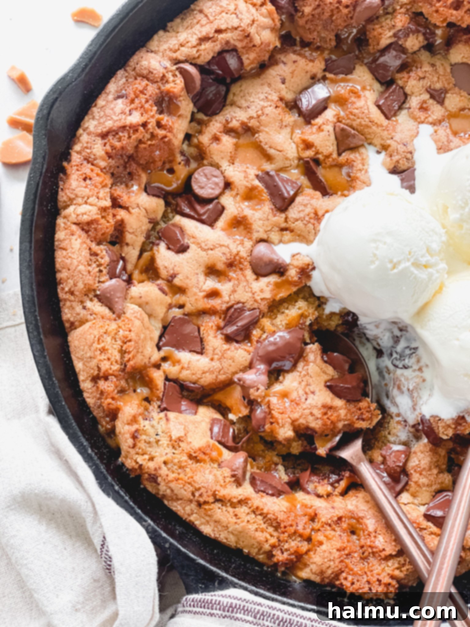 Gooey Brown Butter Toffee Skillet Cookie 3 Close-up of the gooey center of the brown butter toffee skillet cookie with melted chocolate and toffee.