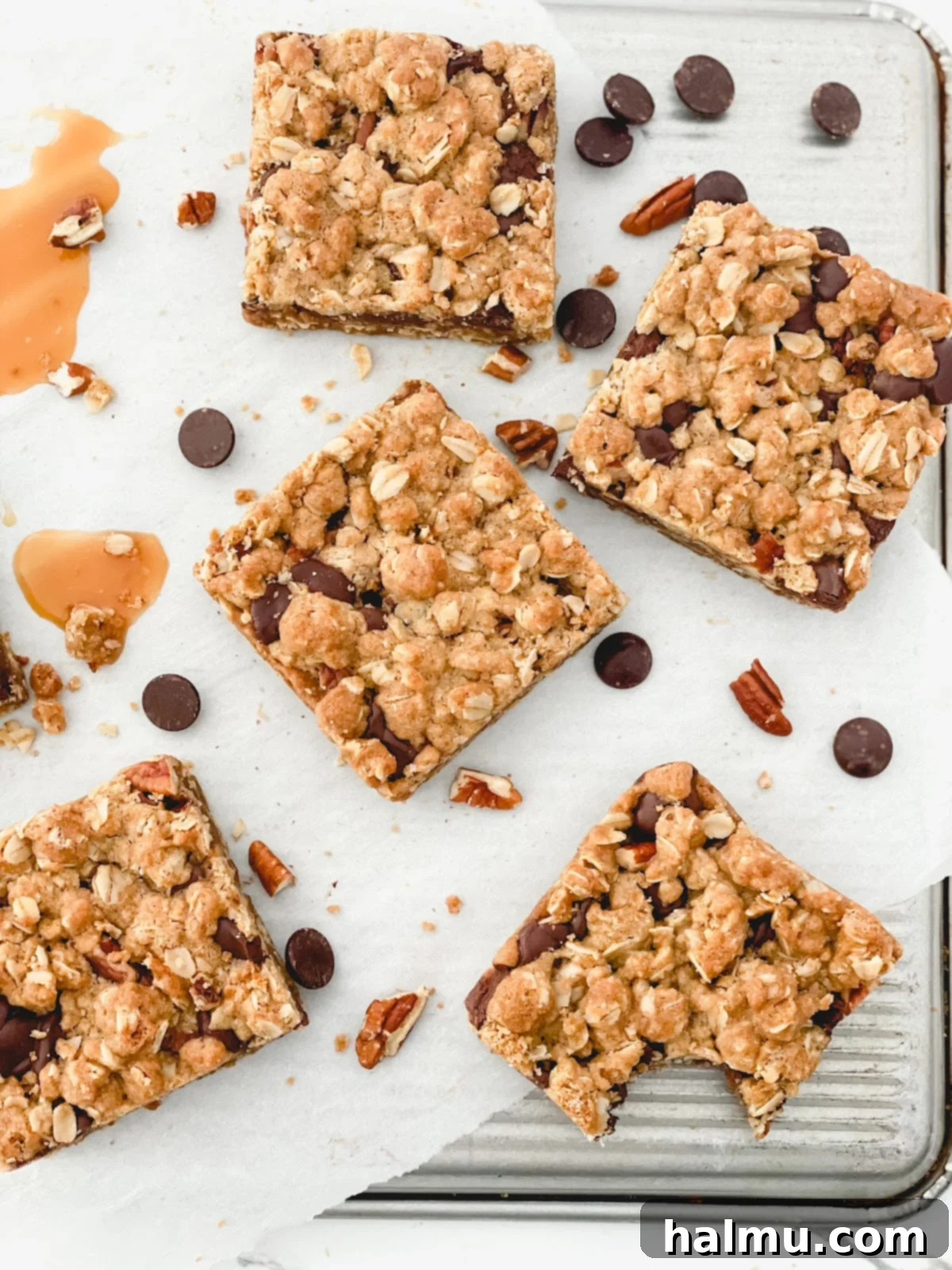 Overhead view of Chocolate Caramel Pecan Bars cooling on a wire rack, showcasing the golden oat topping and hints of chocolate and caramel.