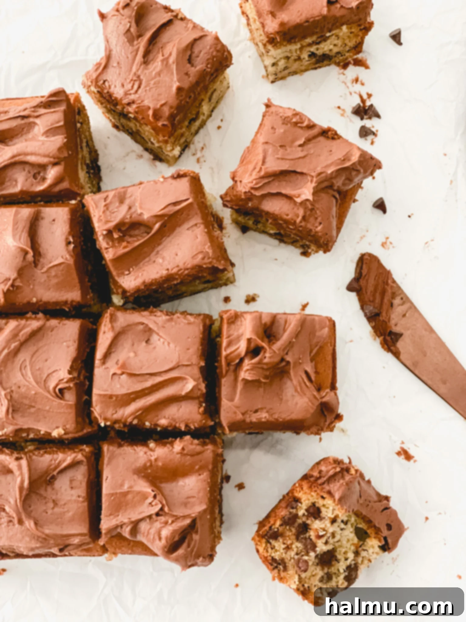 Close-up of a slice of chocolate chip banana cake with chocolate cream cheese frosting
