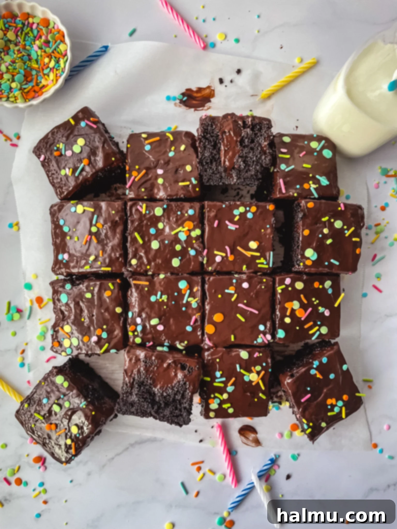 A beautifully moist chocolate pudding poke cake, topped with smooth, dark chocolate pudding and ready to be served.