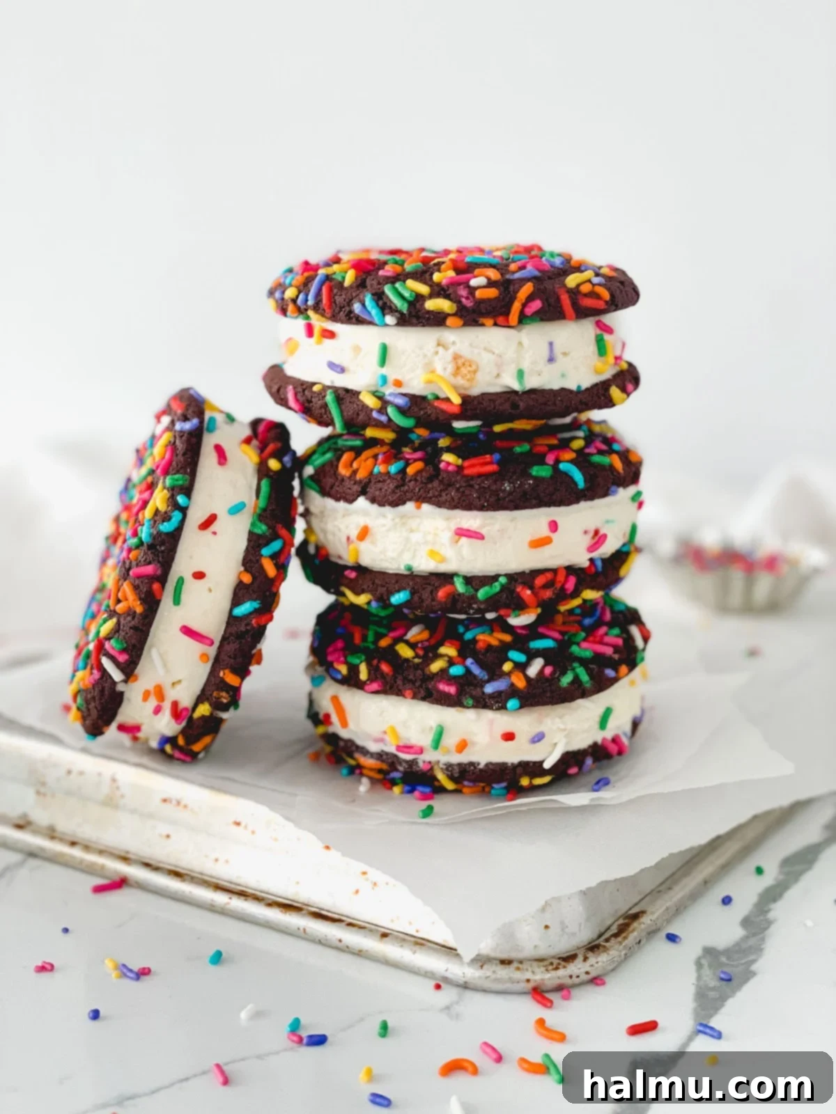 Chocolate Sprinkle Cookie Ice Cream Stacks 4 A close-up shot of a chocolate sprinkle cookie with a golden brown edge.