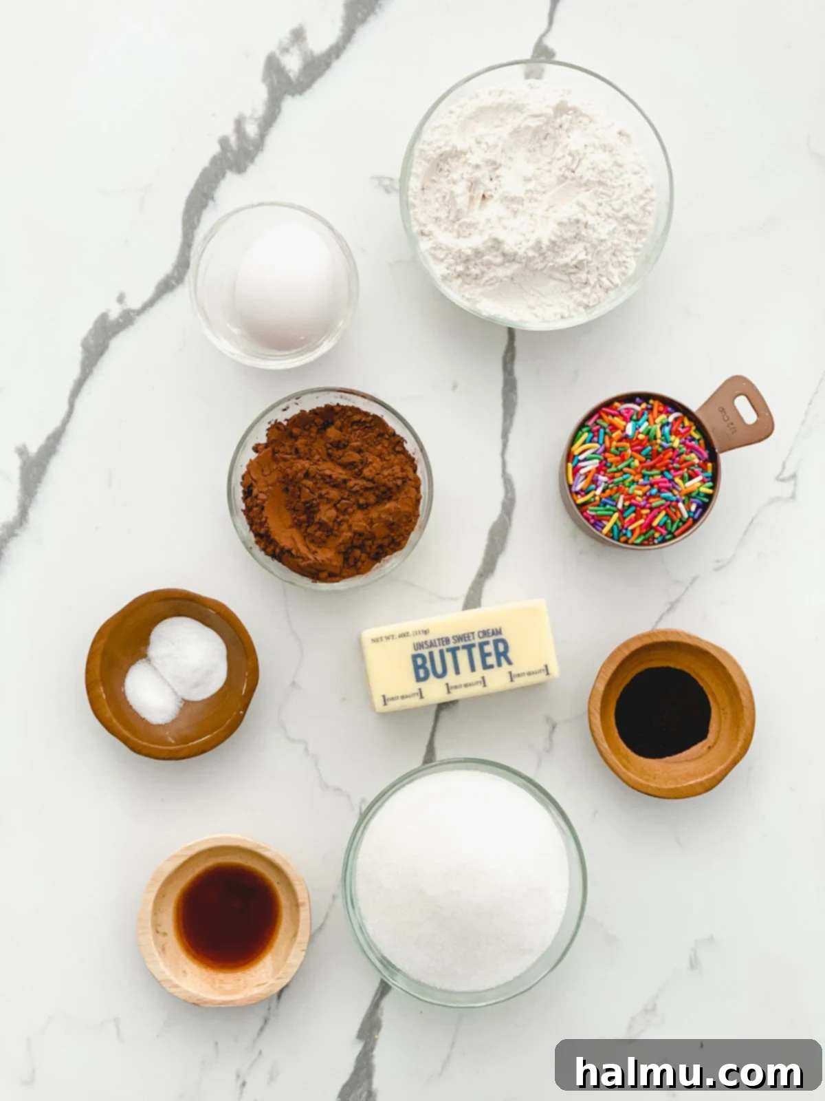 Chocolate Sprinkle Cookie Ice Cream Stacks 5 Softened ice cream being spread onto a baking sheet lined with plastic wrap.