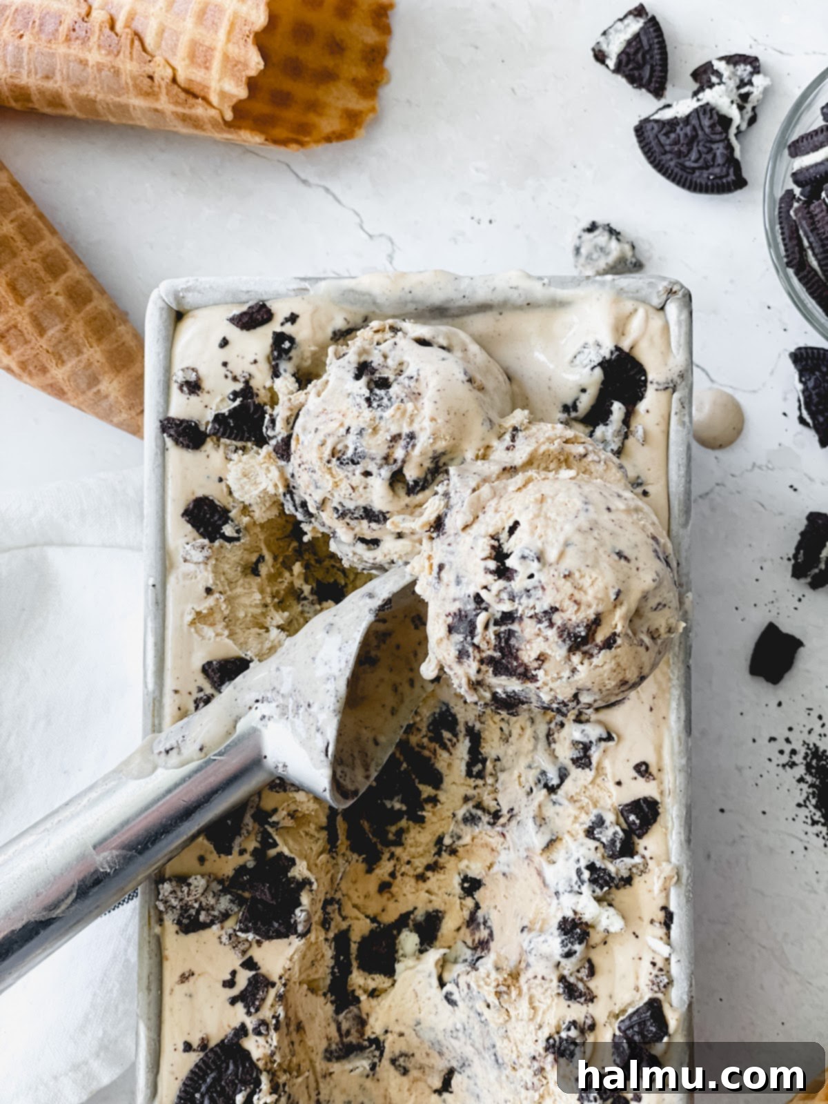 Espresso Oreo Ice Cream, scooped into a bowl, with crushed Oreos on top.