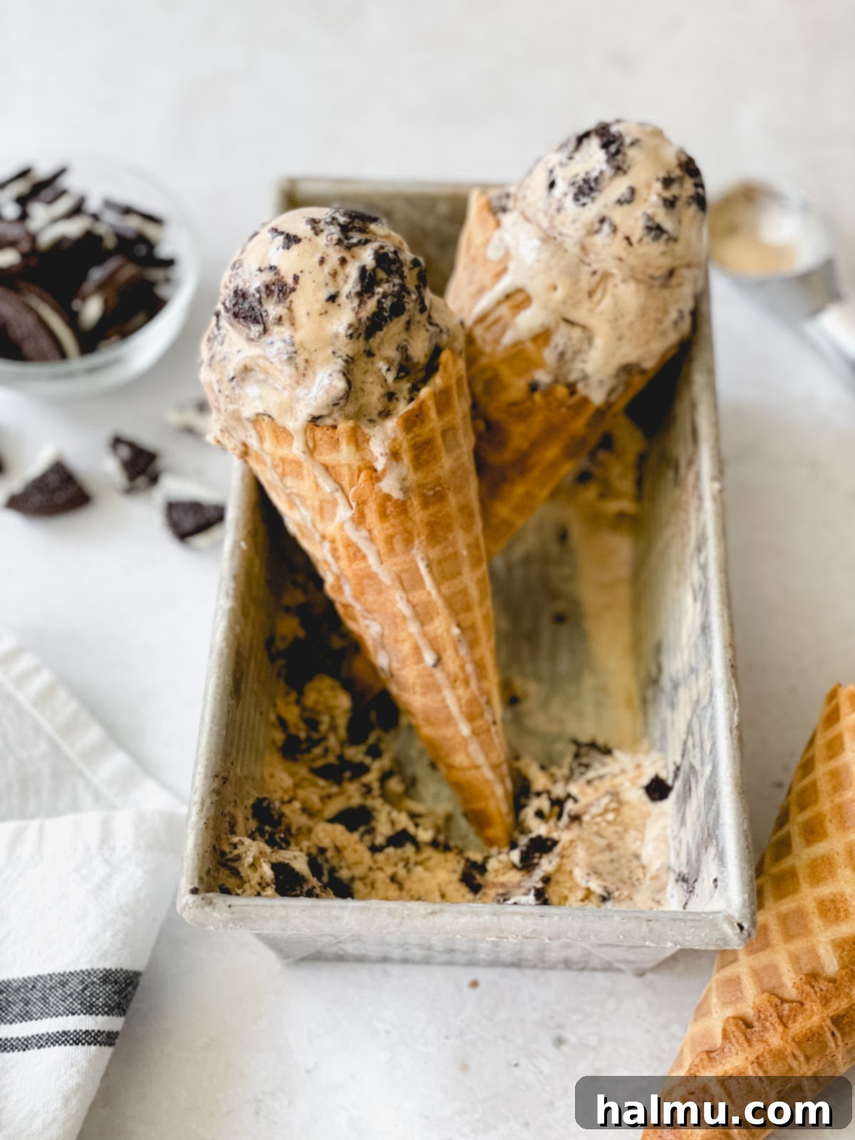 Step-by-step image of whisking the ice cream mixture before adding Oreos.