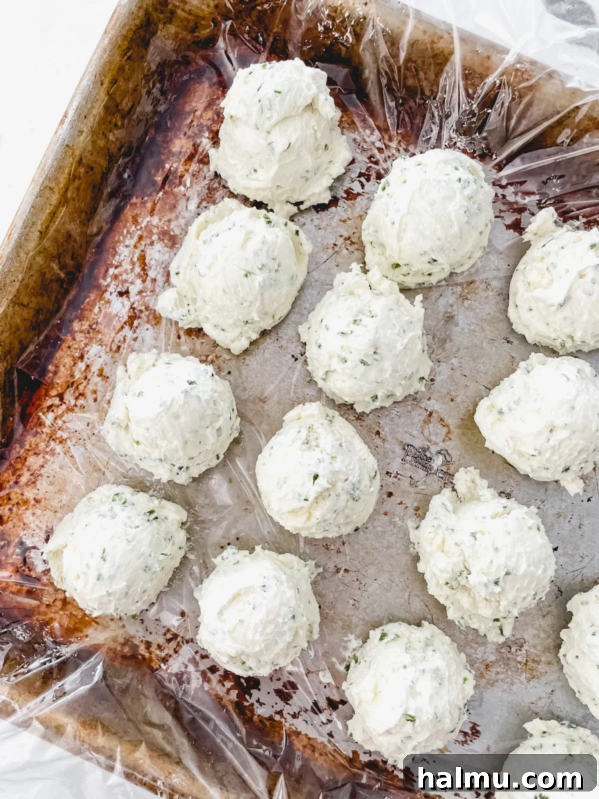 Shaping the bagel bites with cream cheese filling before rolling