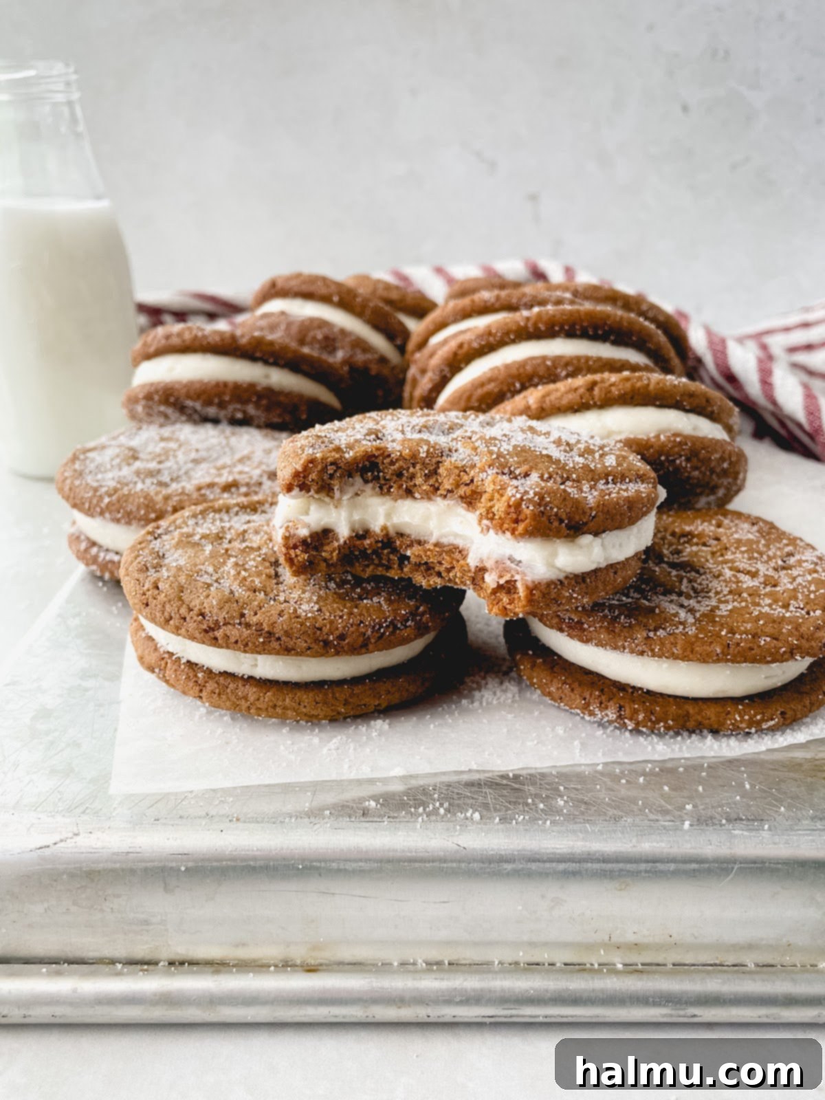 Ginger Molasses Sandwich Cookies 8 A festive holiday table setting with several plates of ginger molasses cookie sandwiches, ready for serving.