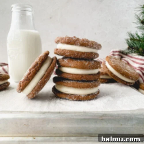 Ginger Molasses Sandwich Cookies 9 A close-up of a stack of Ginger Molasses Cookie Sandwiches on a wooden board.