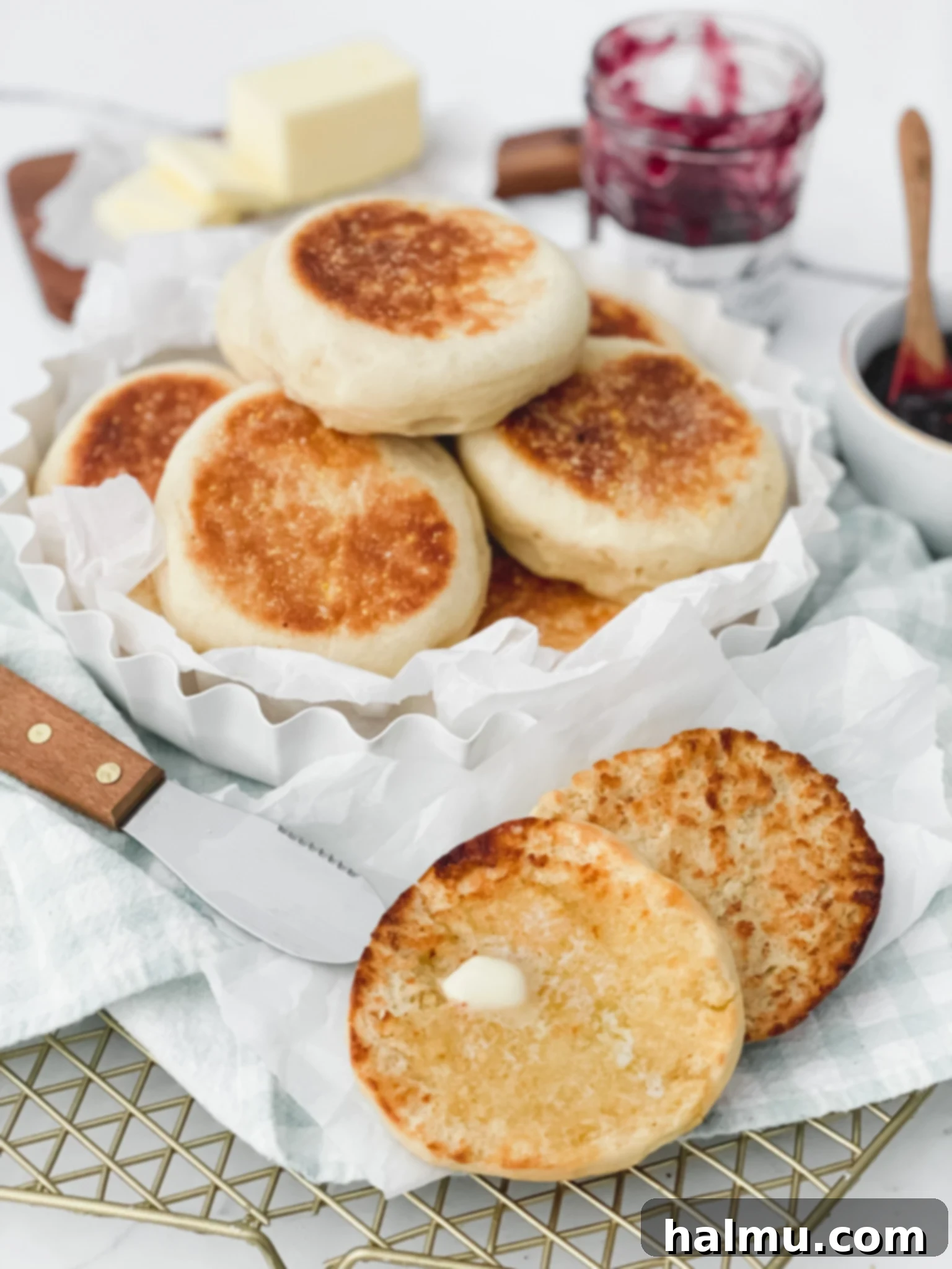Freshly baked English muffins on a cooling rack