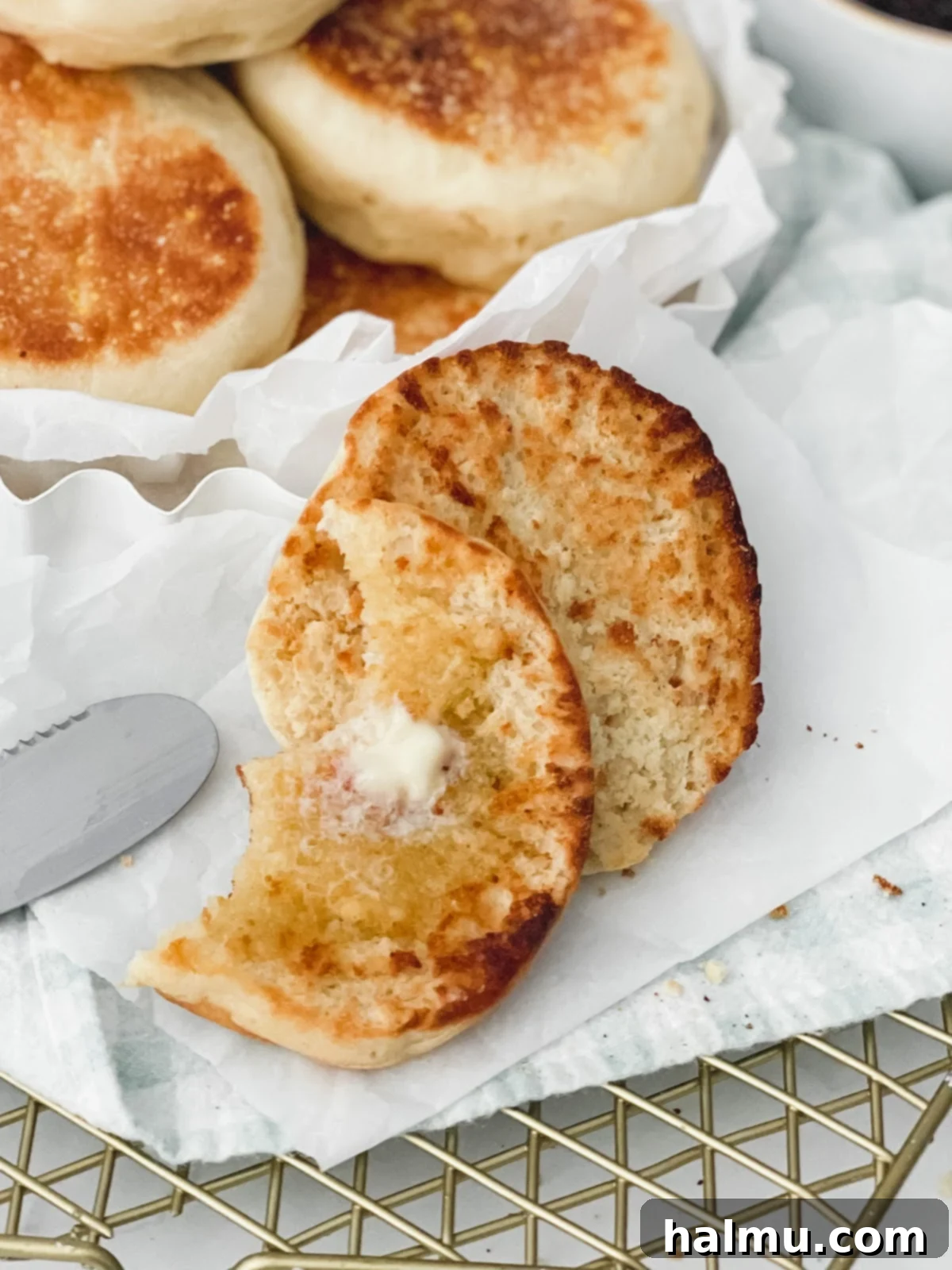 Close-up of a stack of golden brown English muffins