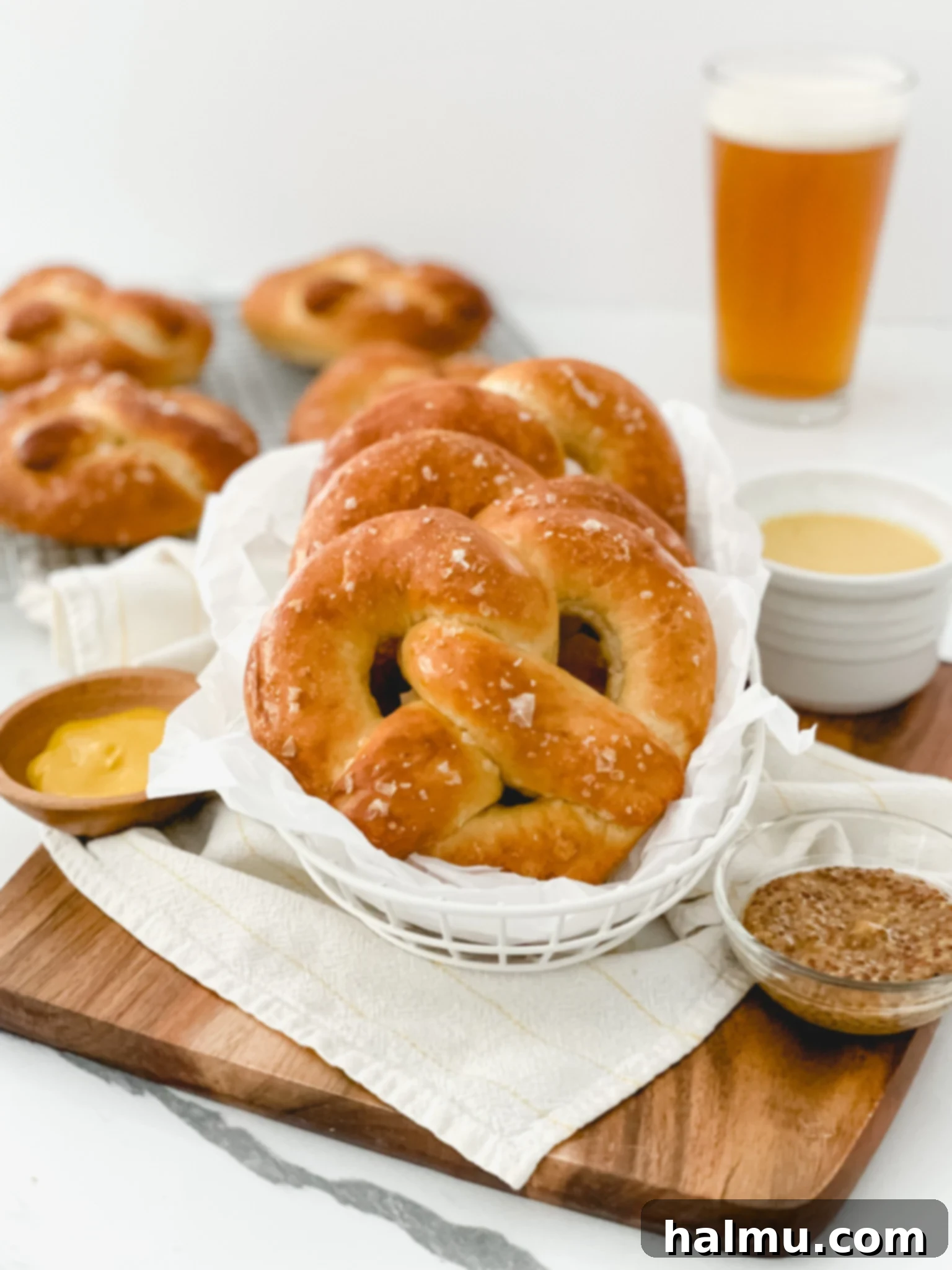 Freshly baked homemade soft pretzels cooling on a wire rack.