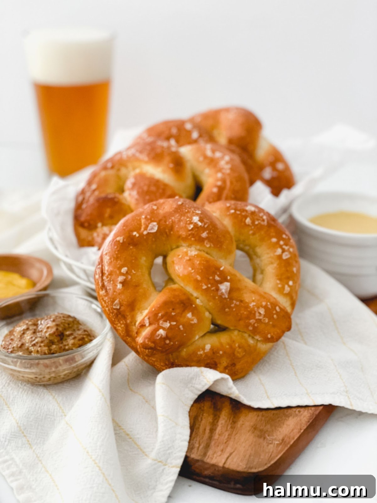 An assortment of homemade pretzels in various shapes, including classic twists, long sticks, and bite-sized pieces.