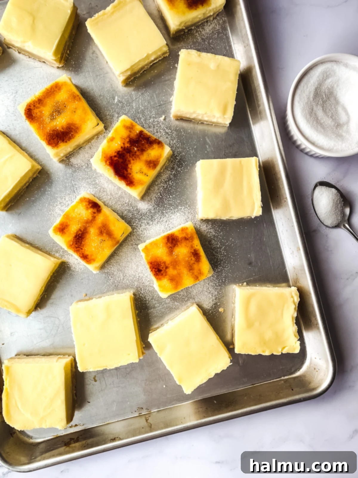 An overhead shot of several Lemon Brûlée Bars, showing the beautiful golden crust and bright yellow custard.