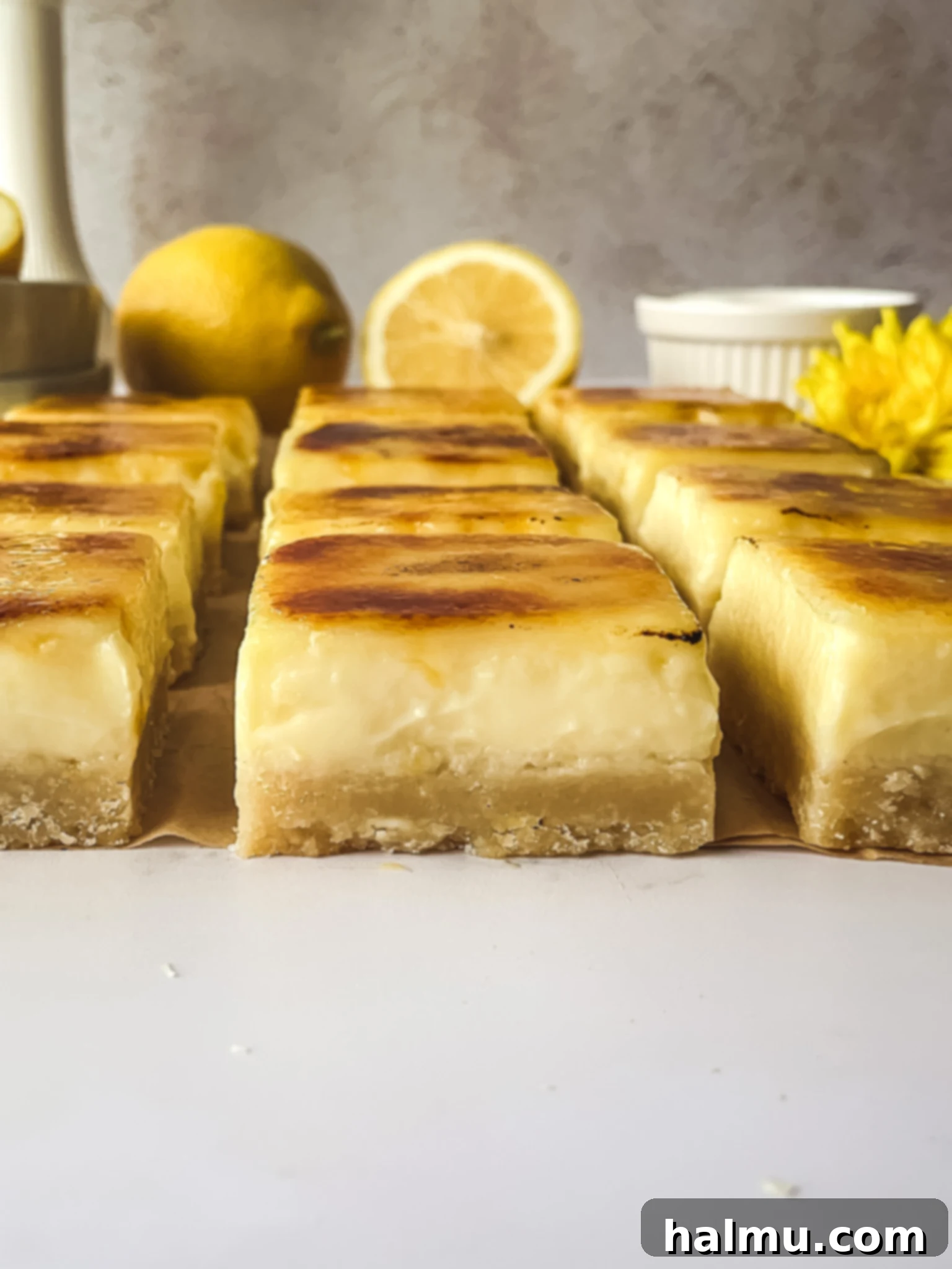 A beautifully torched Lemon Brûlée Bar with a golden-brown sugar crust and a soft, creamy lemon filling visible.