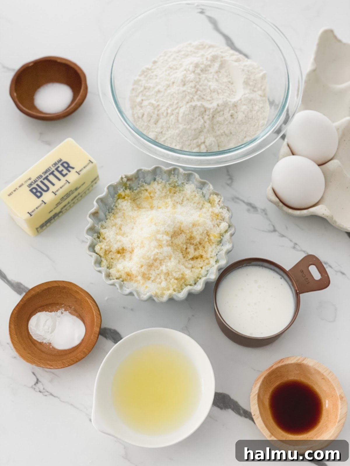 Three mini lemon bundt cakes displayed on a wooden board