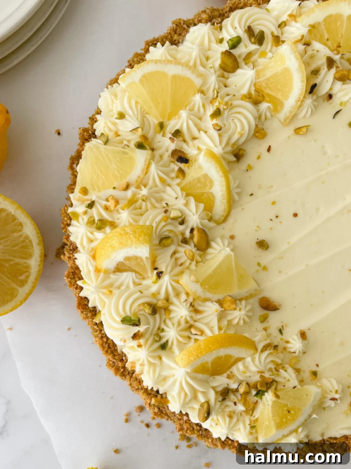 Luscious Lemon Mascarpone Tart 6 Variety of baking tools laid out, including an offset spatula and piping tips.