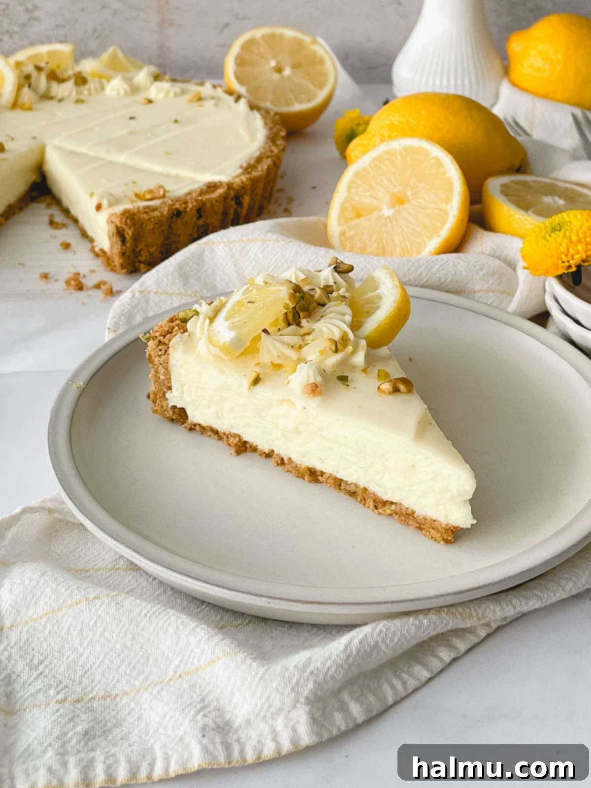 Luscious Lemon Mascarpone Tart 8 Slice of Lemon Mascarpone Tart on a plate, ready to be eaten.