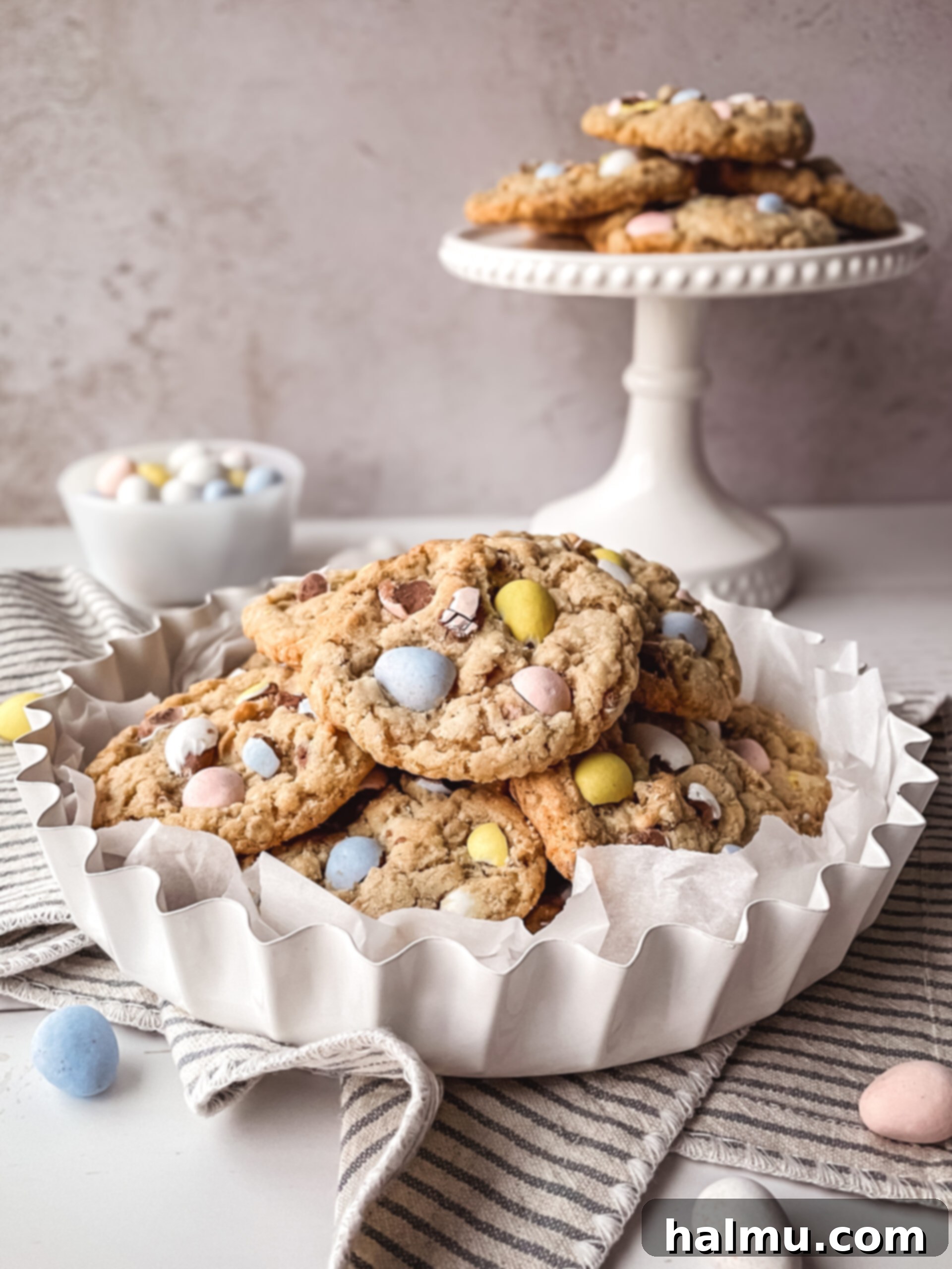 Mini Egg Oatmeal Cookies 8 Various Easter themed desserts on a table, including Mini Egg Oatmeal Cookies.