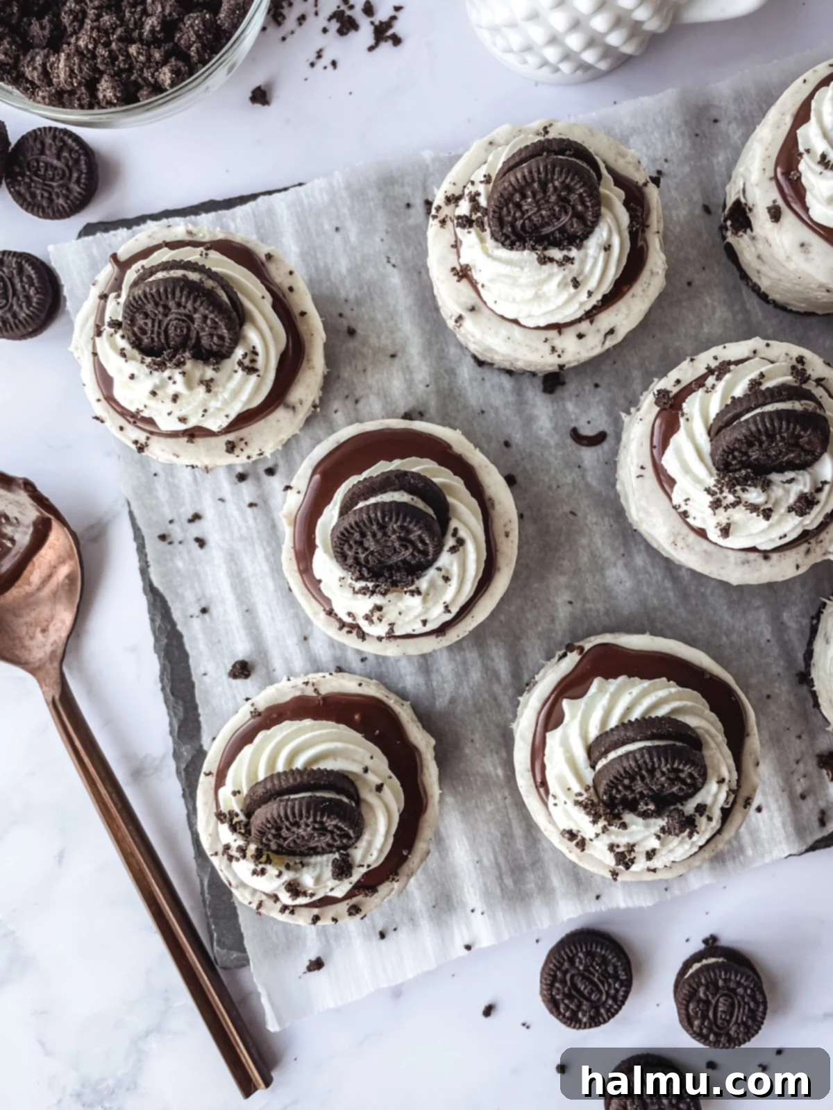 Rows of Mini Oreo Cheesecakes cooling in a mini cheesecake pan.