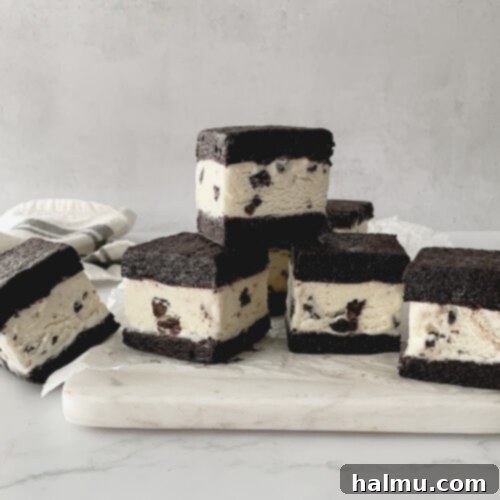 Refreshing Mint Chocolate Chip Ice Cream Delights 8 A stack of delicious Mint Chocolate Chip Brownie Ice Cream Sandwiches, ready to be served.