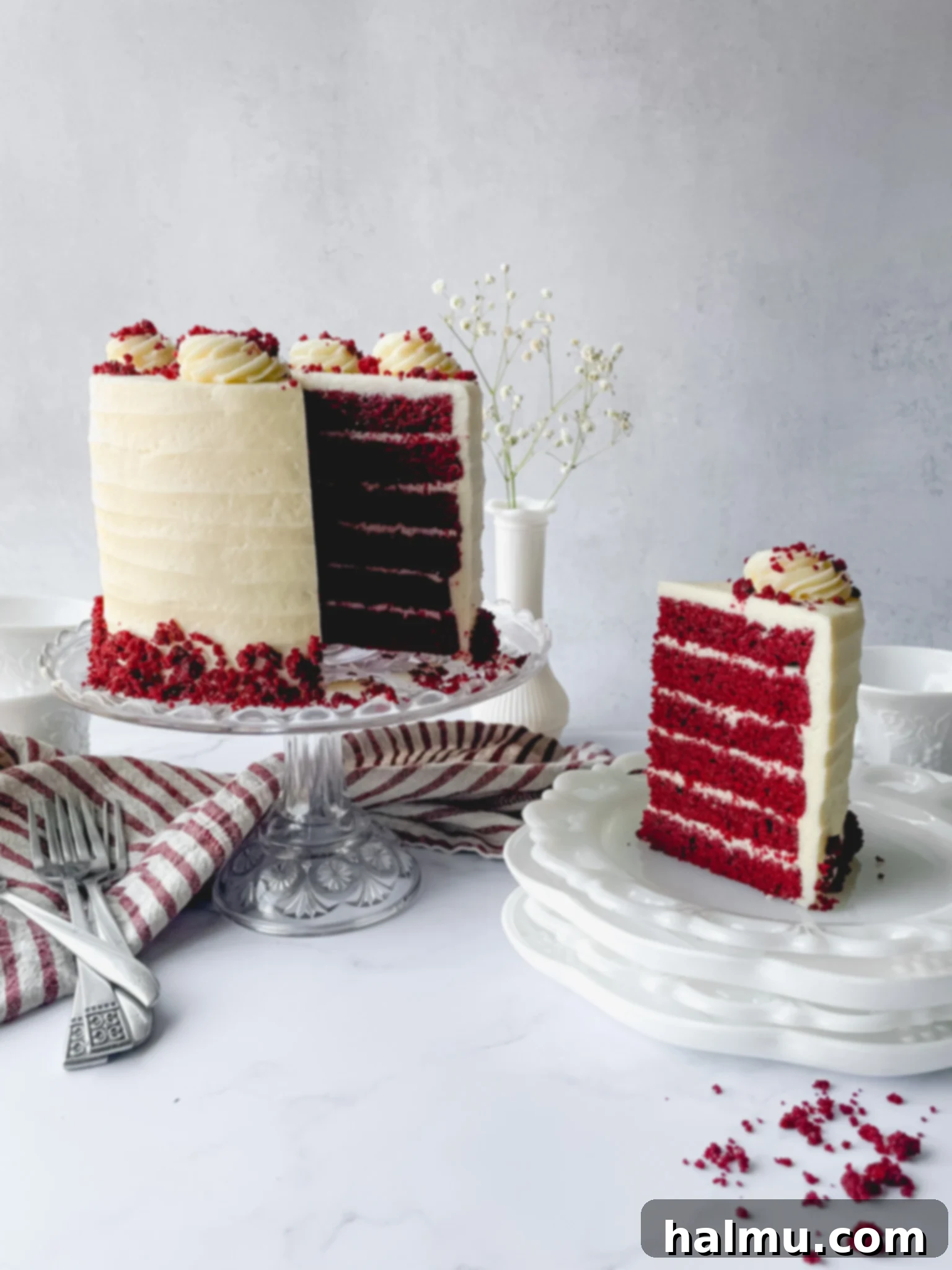 Heirloom Red Velvet Cake 6 Beautifully stacked red velvet cake layers being frosted with the Old Fashioned Frosting.