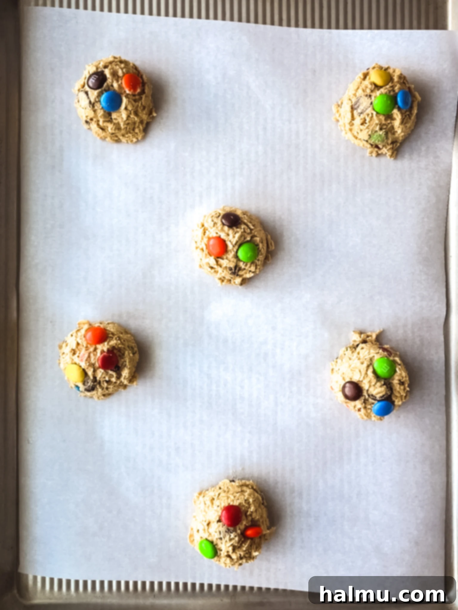 Freshly baked Peanut Butter Monster Cookies on a cooling rack.