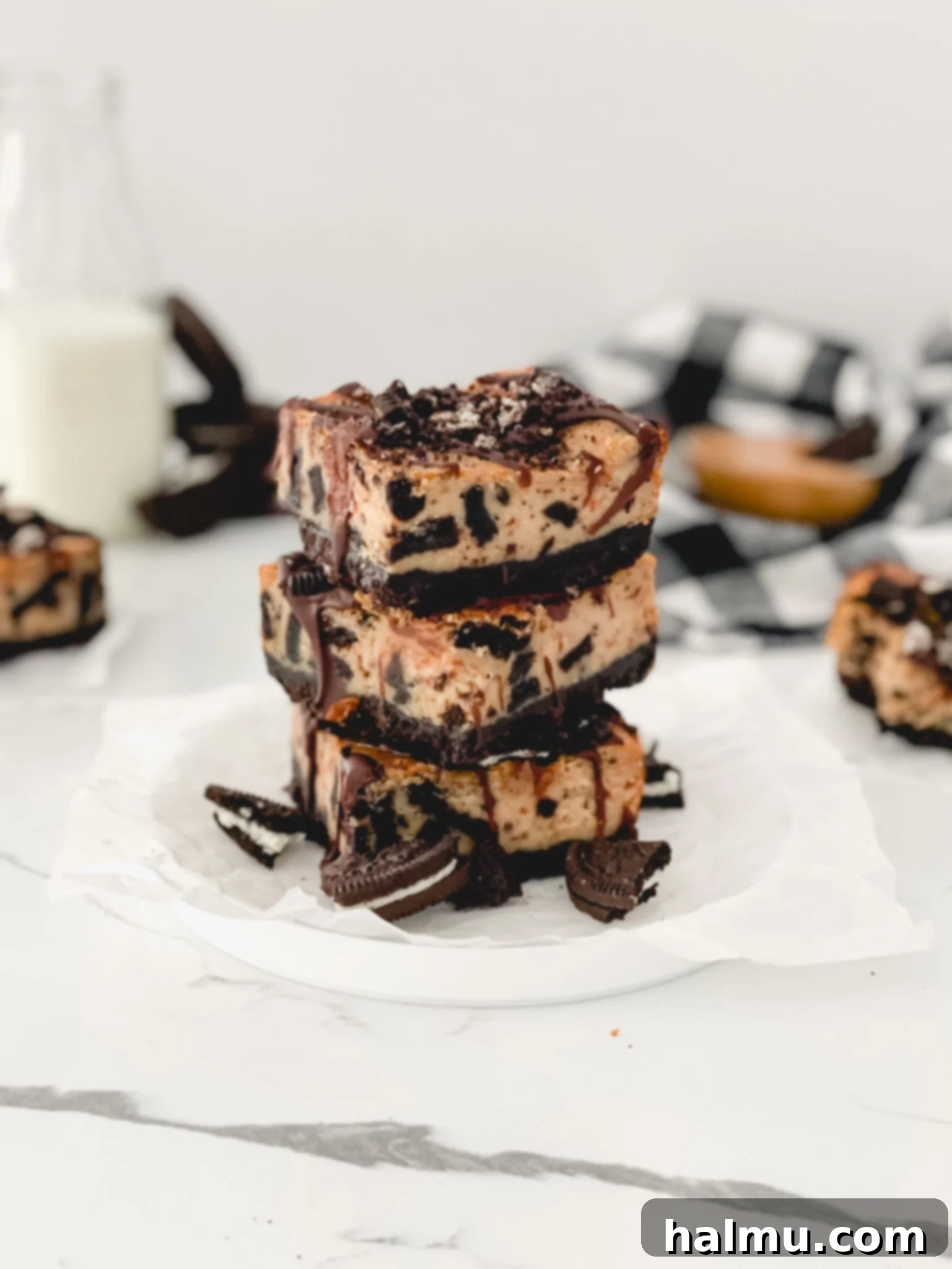 Delicious Peanut Butter Oreo Cheesecake Bars arranged on a plate, ready to be enjoyed.