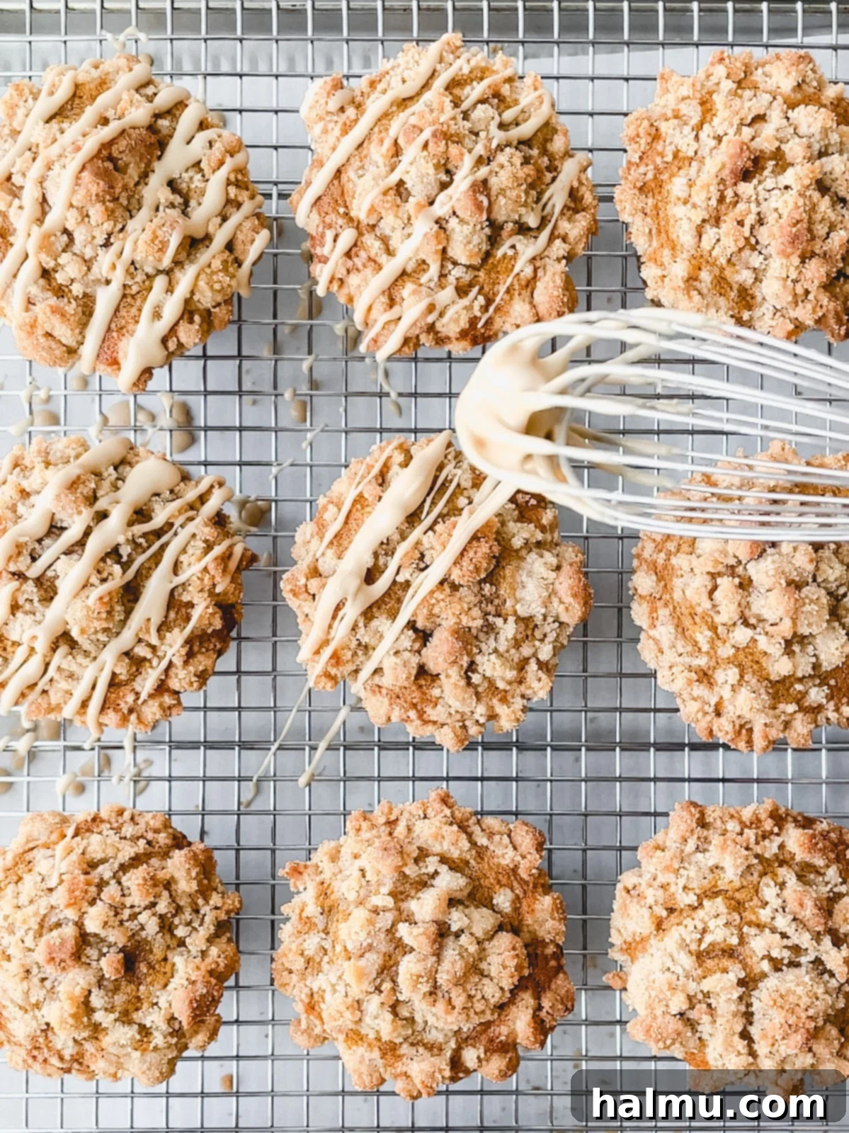 Harvest Pumpkin Cinnamon Crumble Muffins 8 A close-up of a glazed Pumpkin Cinnamon Streusel Muffin, ready to be enjoyed with a cup of coffee.