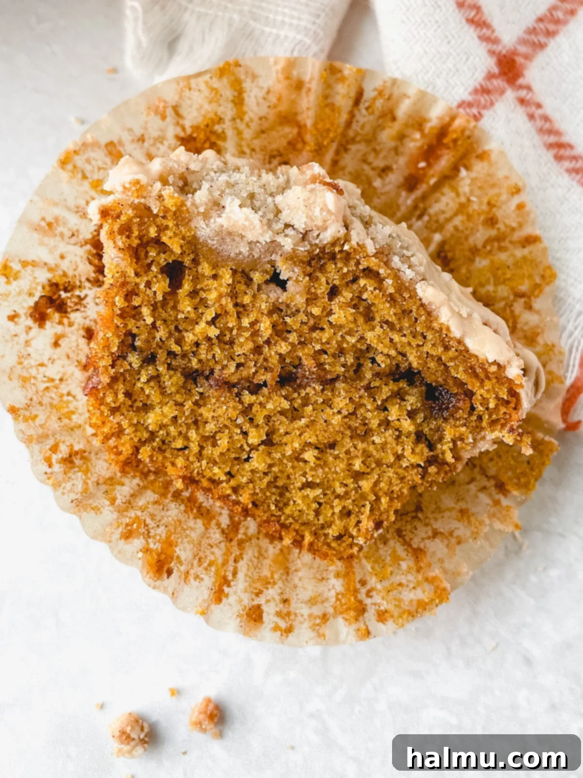 Harvest Pumpkin Cinnamon Crumble Muffins 9 A final shot of several Pumpkin Cinnamon Streusel Muffins on a cooling rack, some with maple glaze, ready to be served.