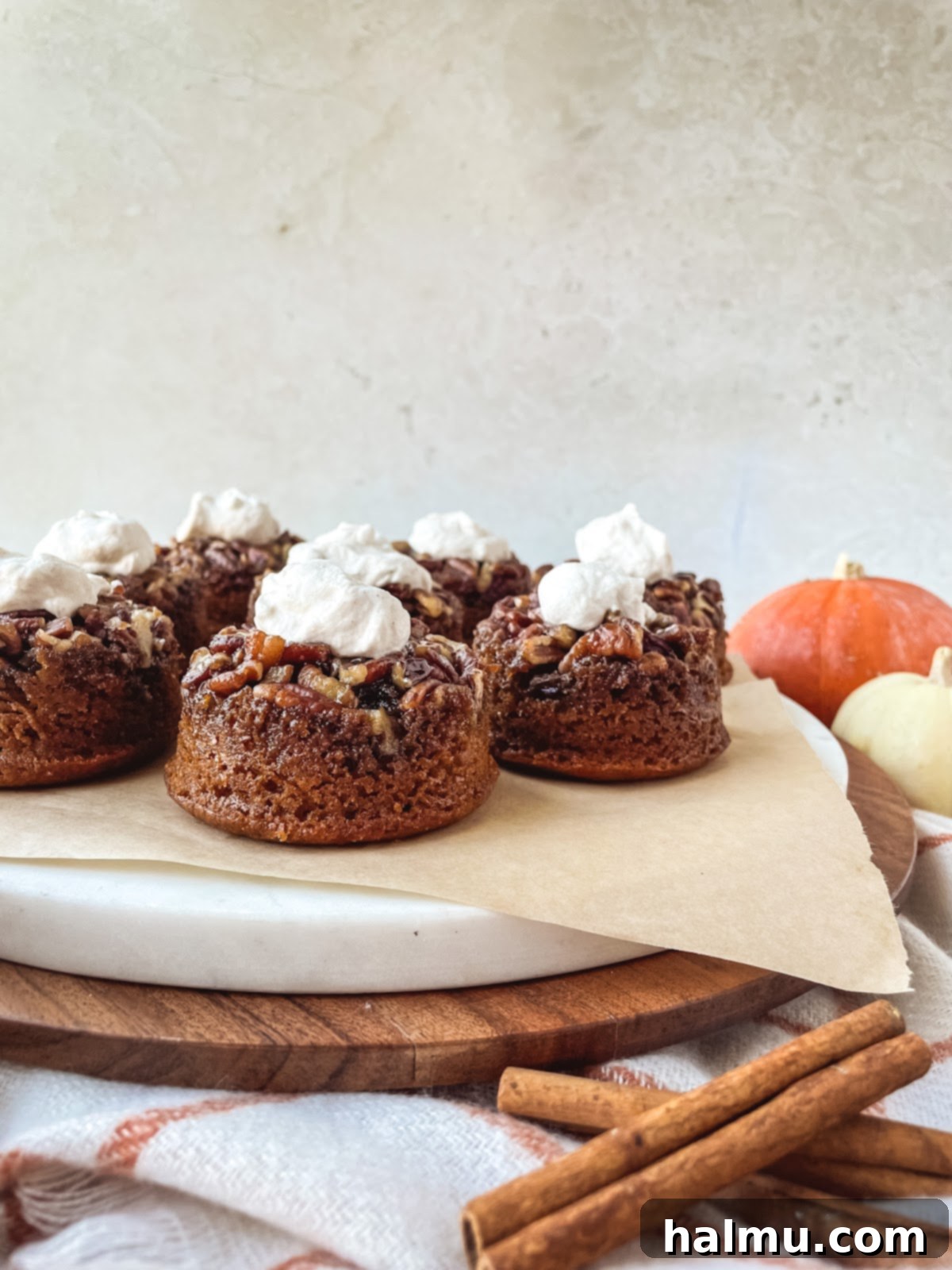 Caramel Pecan Pumpkin Flips 3 Close-up of a pumpkin pecan upside-down cake with pecan topping
