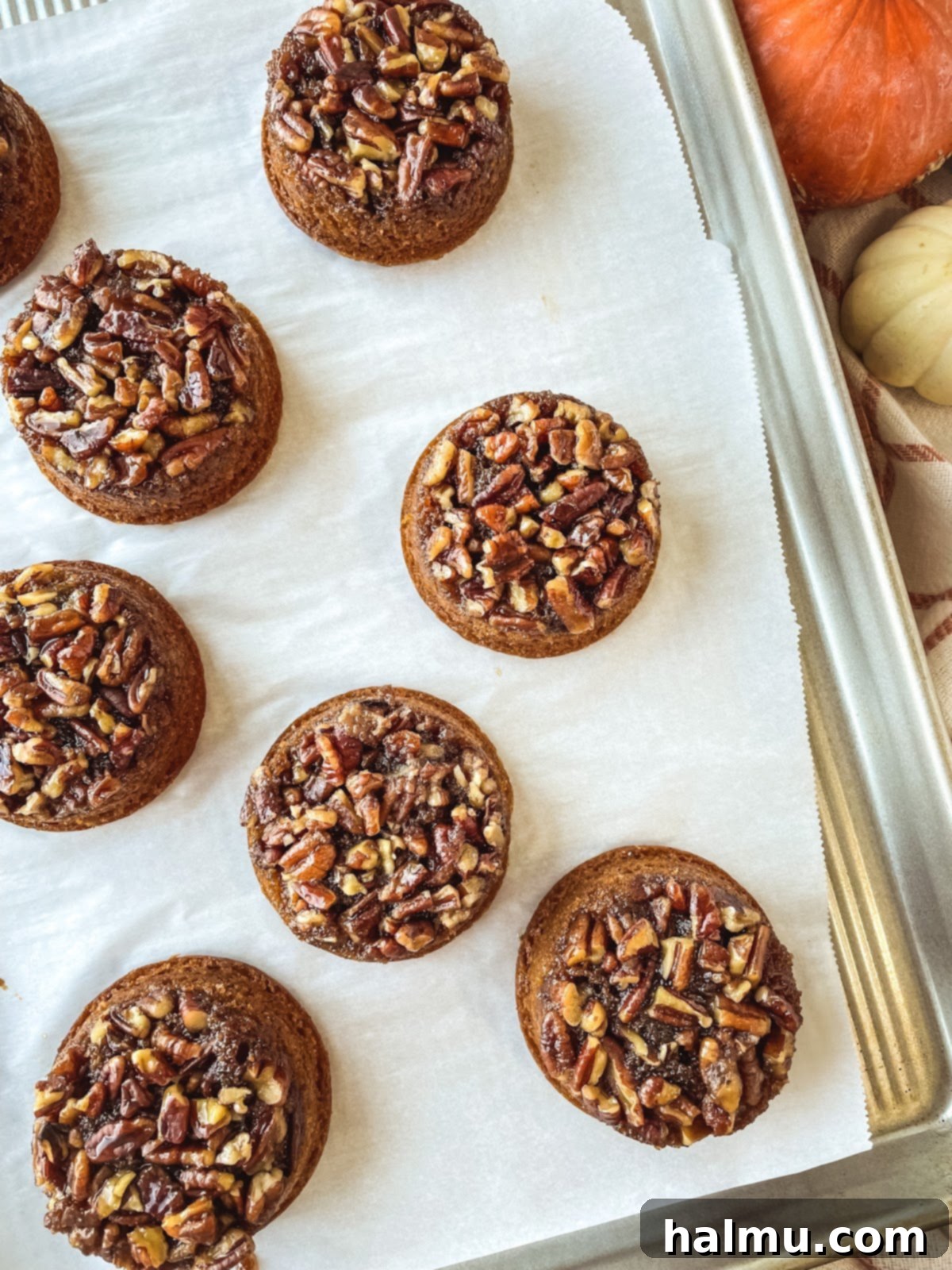 Caramel Pecan Pumpkin Flips 7 A stack of individual pumpkin pecan upside-down cakes