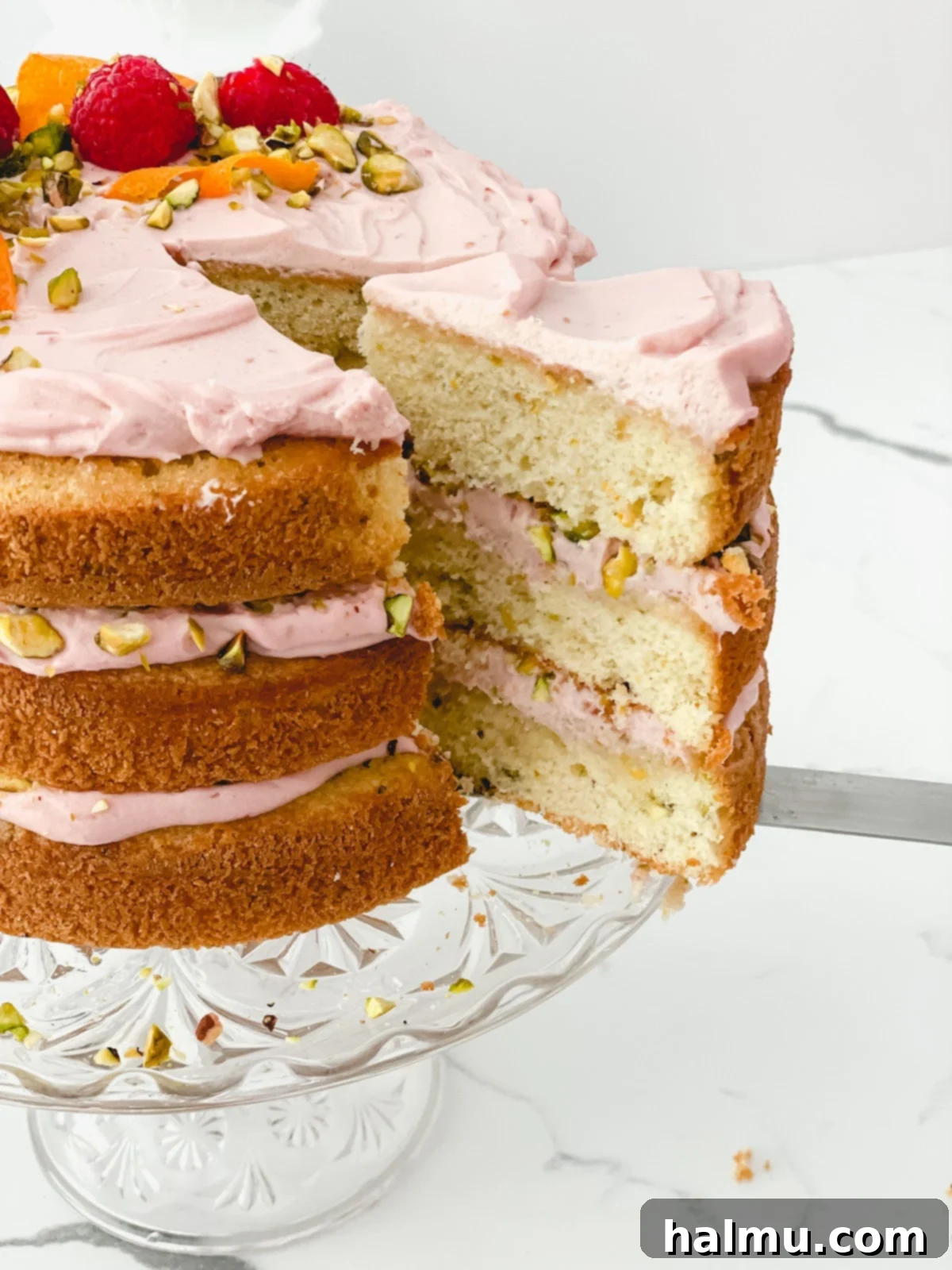 A stack of Raspberry Orange Pistachio Cake layers, ready for assembly.
