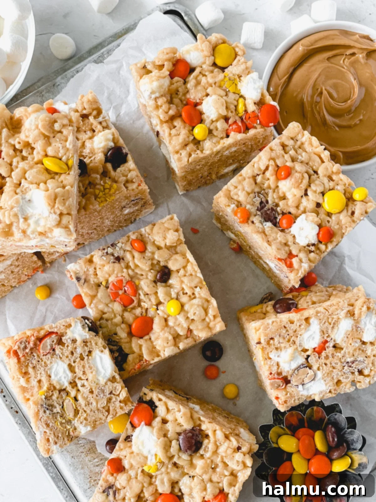 Reeses Pieces Crispy Treats 3 Close-up of Reese's Pieces candies scattered on a surface.