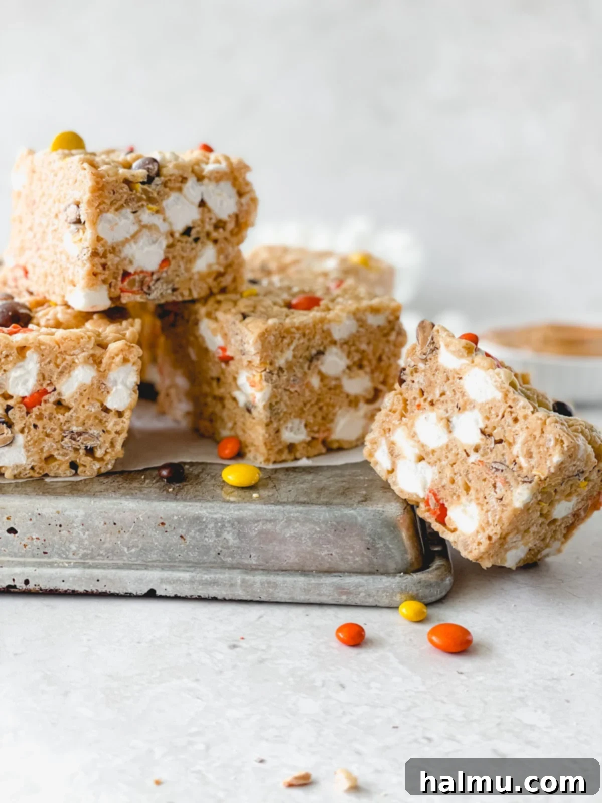 Reeses Pieces Crispy Treats 4 Ingredients for Reese's Pieces Rice Krispie Treats laid out: butter, peanut butter, marshmallows, rice cereal, and Reese's Pieces.