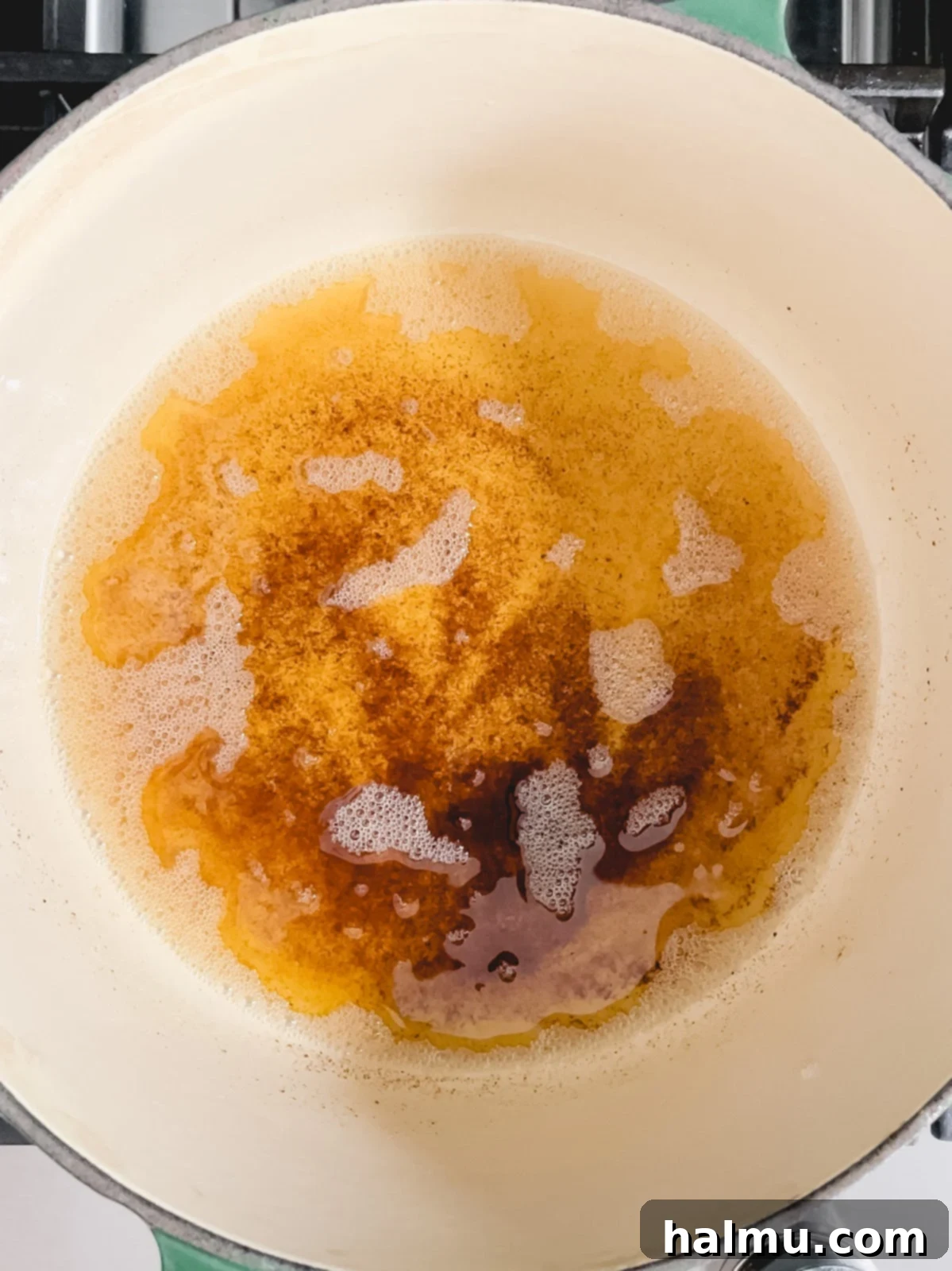 Reeses Pieces Crispy Treats 5 Butter melting in a saucepan on the stove, beginning to foam.