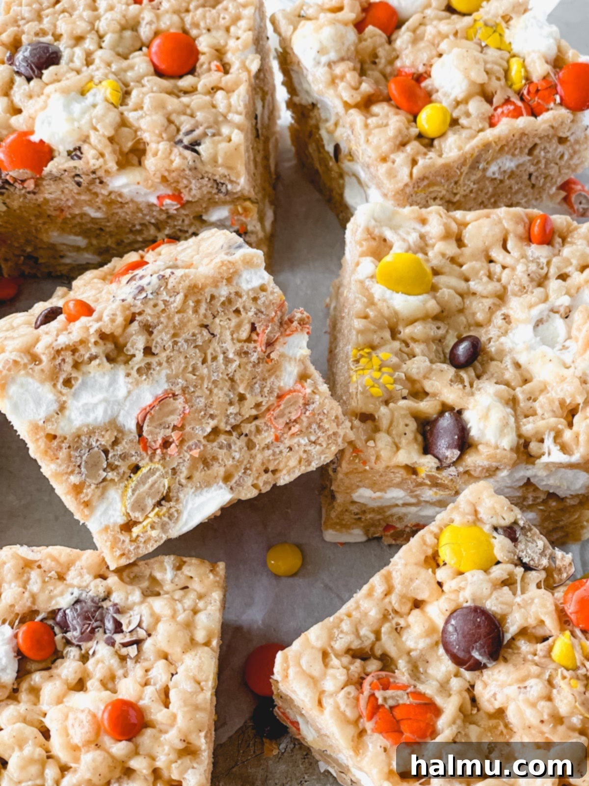 Reeses Pieces Crispy Treats 9 Close-up of a stack of Reese's Pieces Rice Krispie Treats, showcasing their chewy texture and colorful candies.