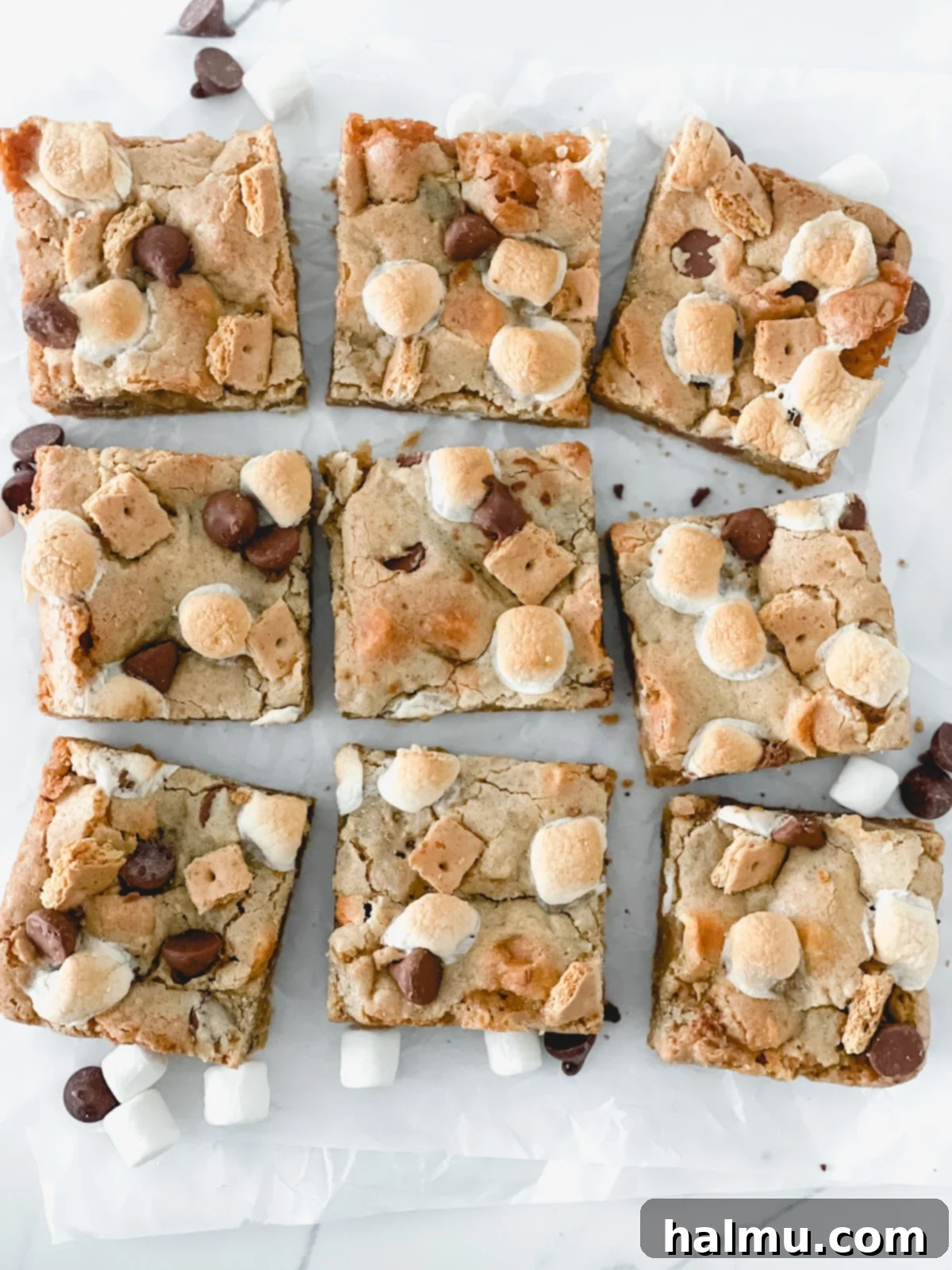 A stack of S'mores Blondies on a white plate, ready to be served.