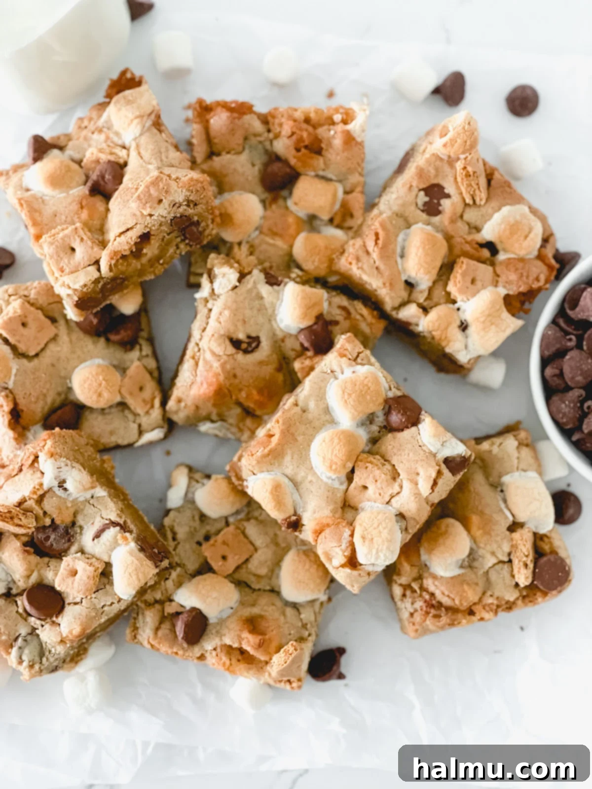 More S'mores Blondies on a wooden board, ready to be enjoyed.