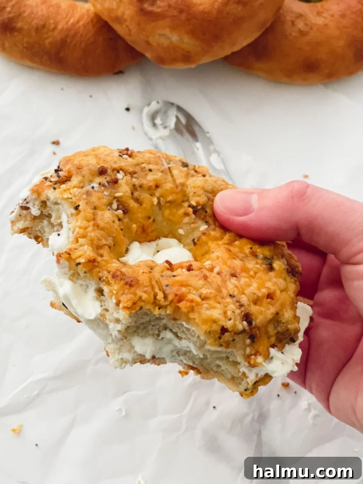 Deliciously Soft and Chewy Bagels 3 A stack of freshly baked soft and chewy bagels cooling on a wire rack