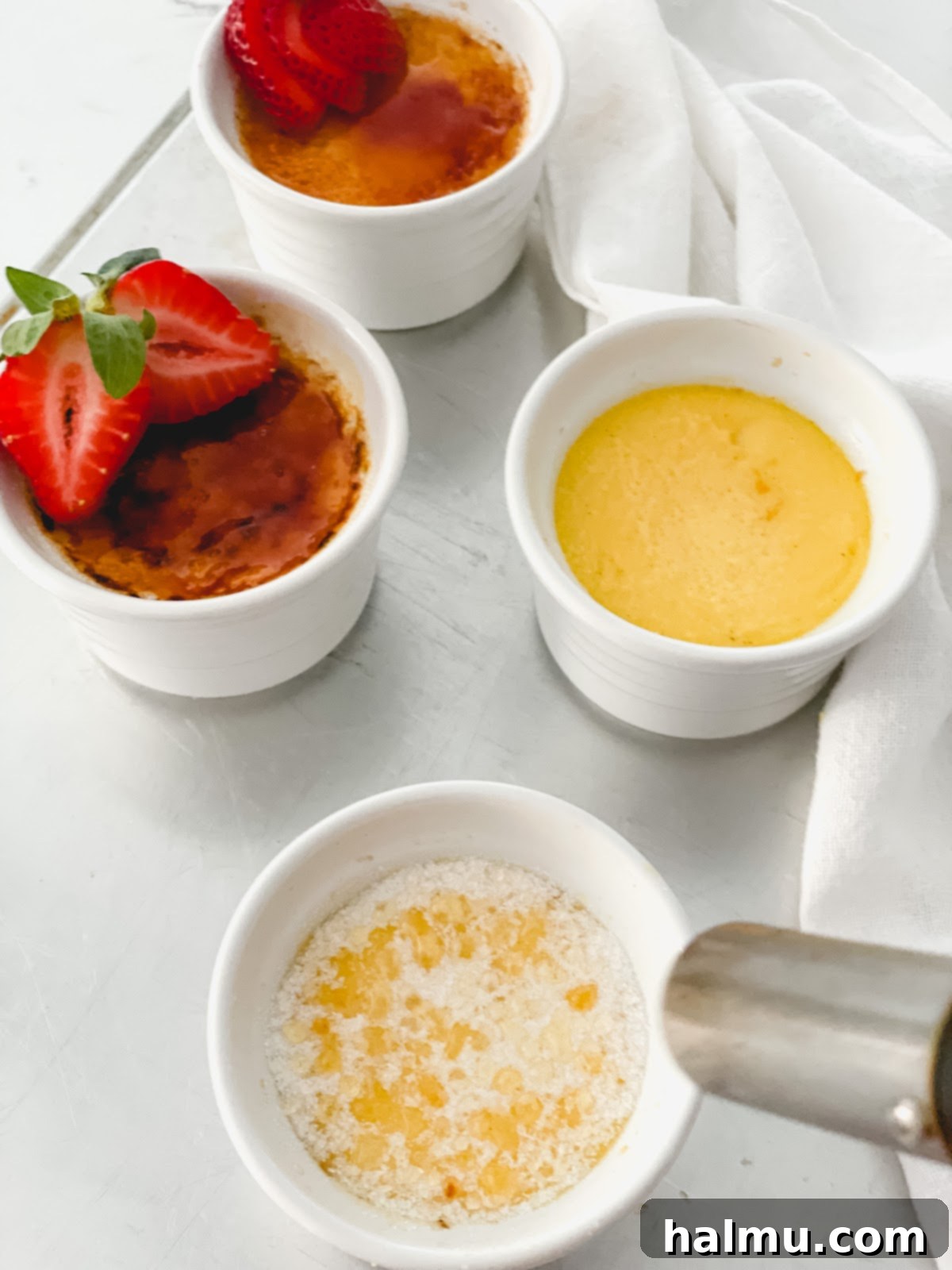 Rich Vanilla Bean Creme Brulee 8 A finished Vanilla Bean Crème Brûlée, showing the thick, perfectly caramelized sugar crust and the creamy custard.