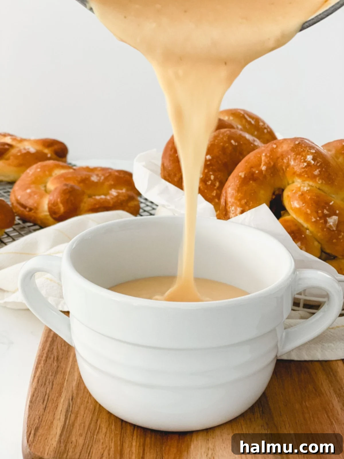 Close-up of Warm Beer Cheese Dip in a rustic ceramic bowl