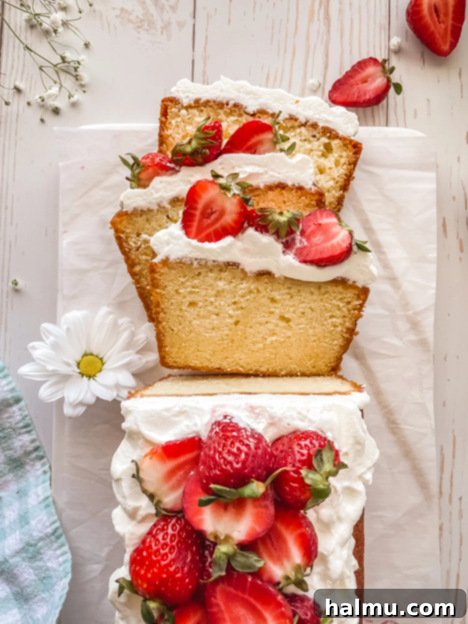 Yuzu Strawberry Pound Cake with whipped cream and fresh strawberries