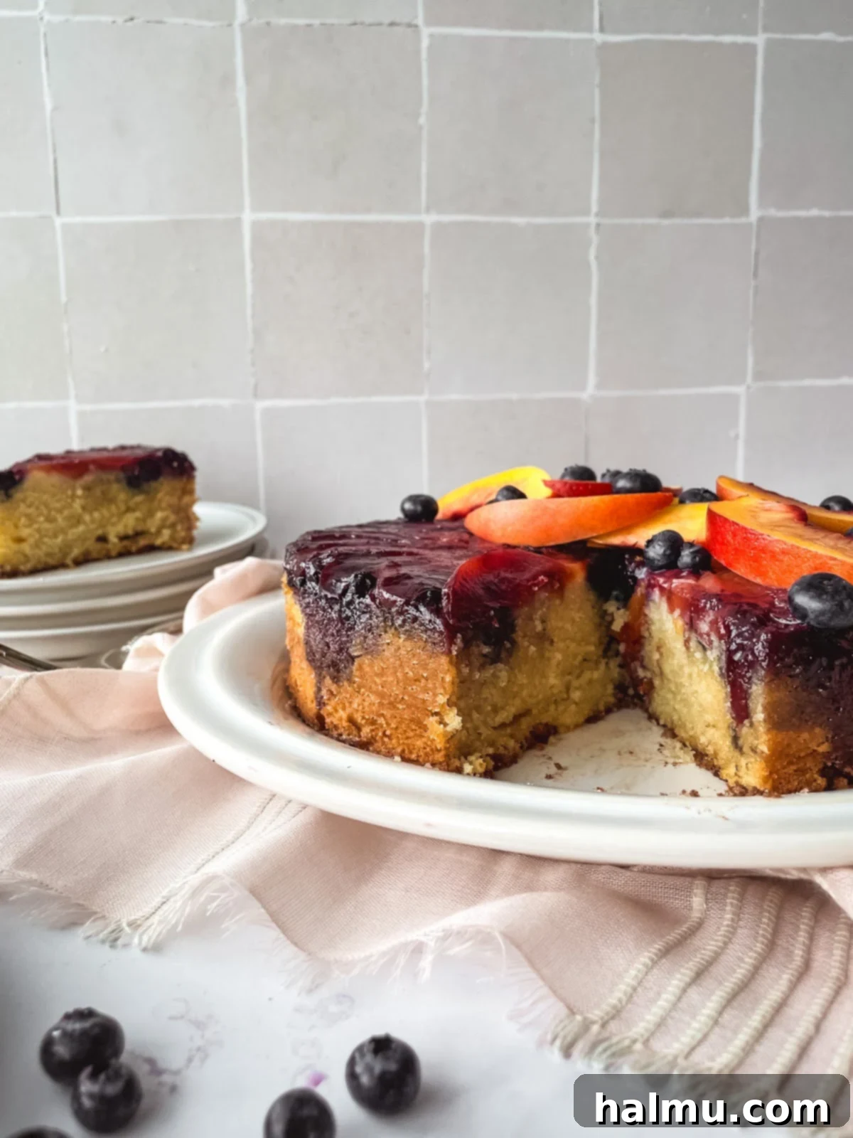 Close-up of the Blueberry Nectarine Upside-Down Cake showing the arrangement of nectarine slices and blueberries before baking.