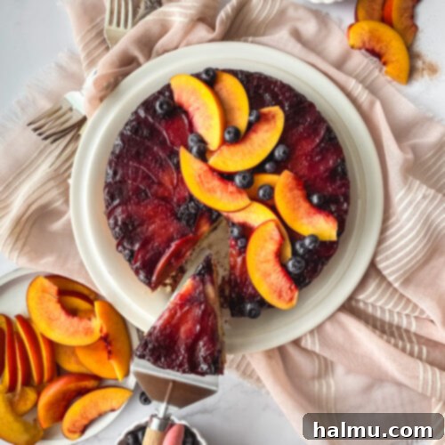 A fully baked Blueberry Nectarine Upside-Down Cake, showing its golden-brown crust and caramelized fruit topping.