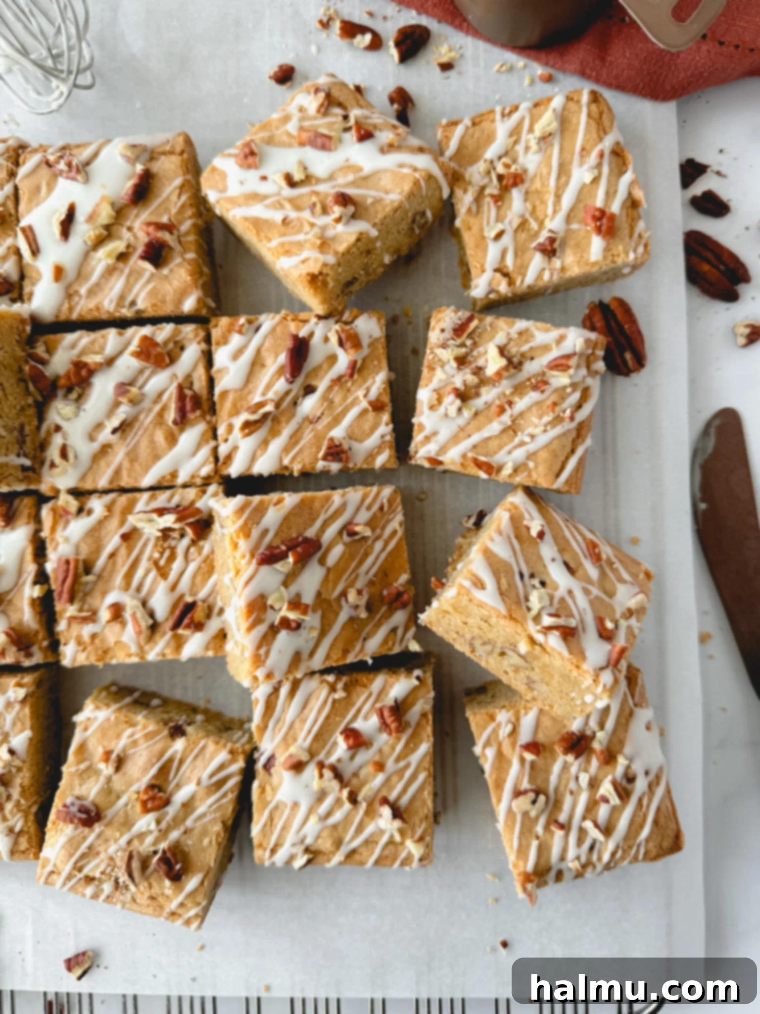 Close-up of golden brown Maple Pecan Blondies, capturing their chewy texture and glistening maple glaze, perfect for fall desserts or Thanksgiving.