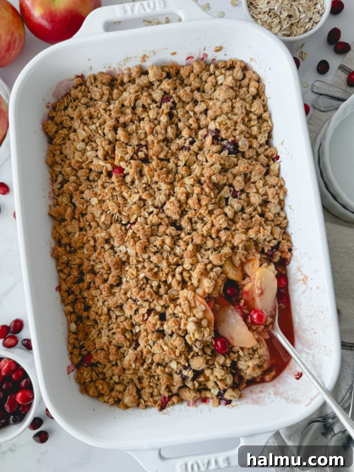 A selection of fresh apples and cranberries, key ingredients for the crisp recipe