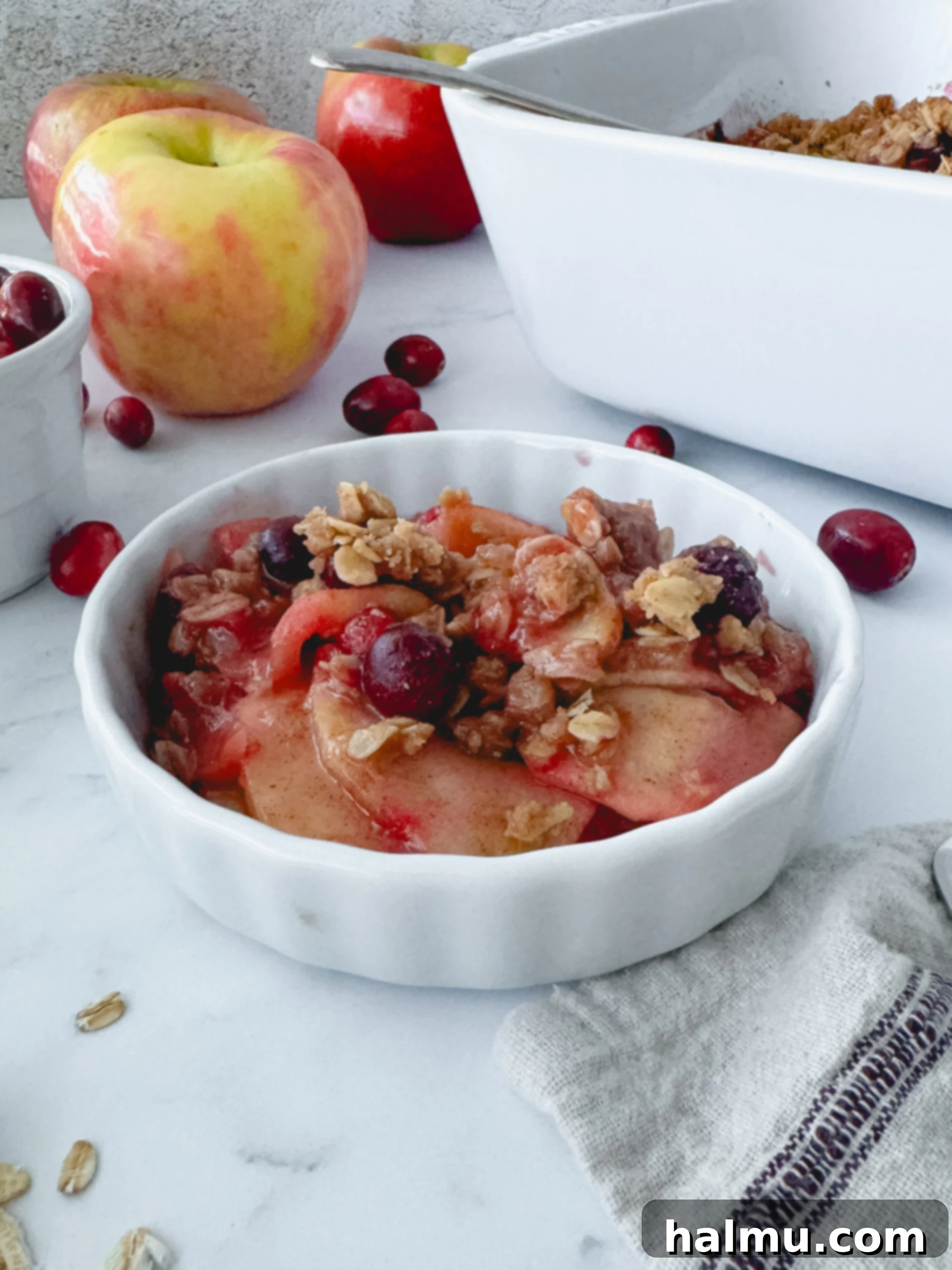 A baked Cranberry Apple Crisp with a golden, streusel-like topping, fresh from the oven