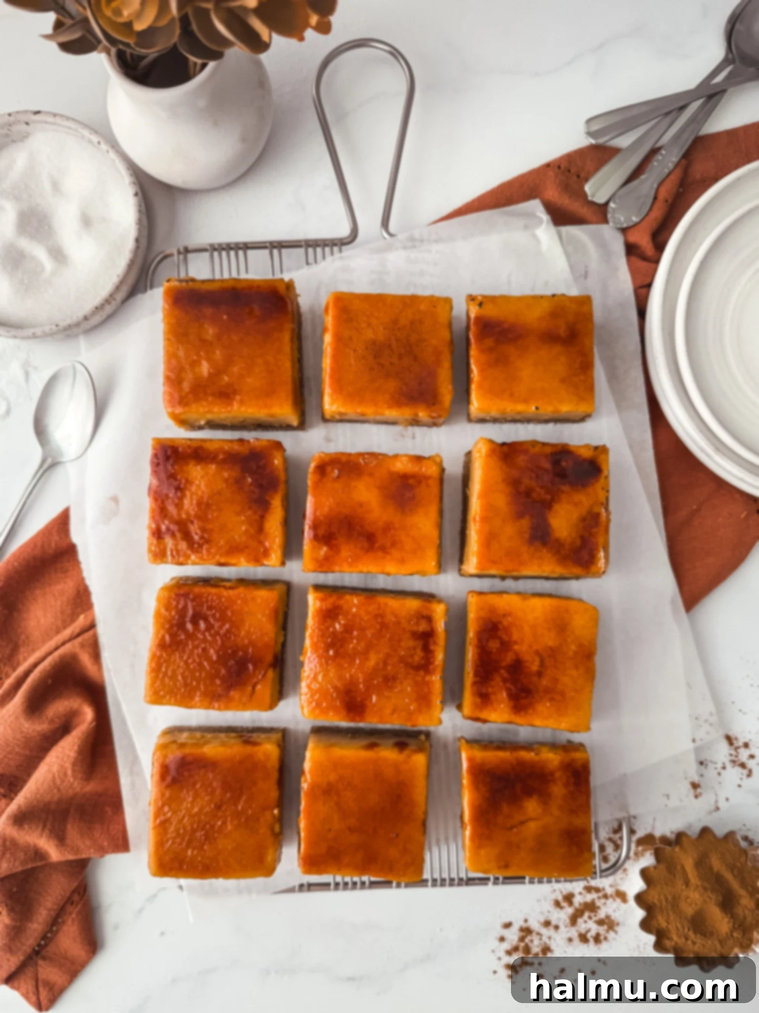 A stack of three Pumpkin Spice Crème Brûlée Bars, showing the distinct layers.