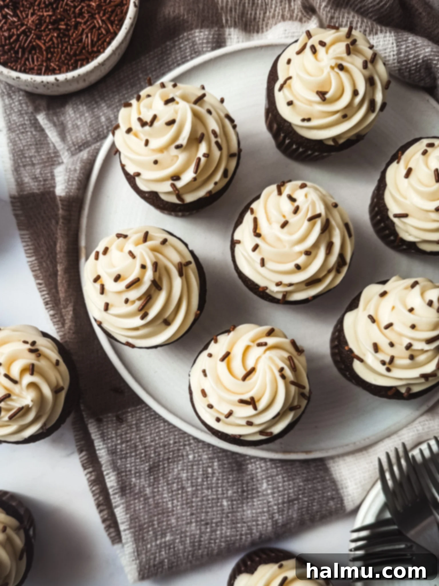 Rich Chocolate Cupcakes with Tangy Cream Cheese Frosting 3 Close-up of a chocolate cupcake with fluffy cream cheese frosting, ready to be decorated