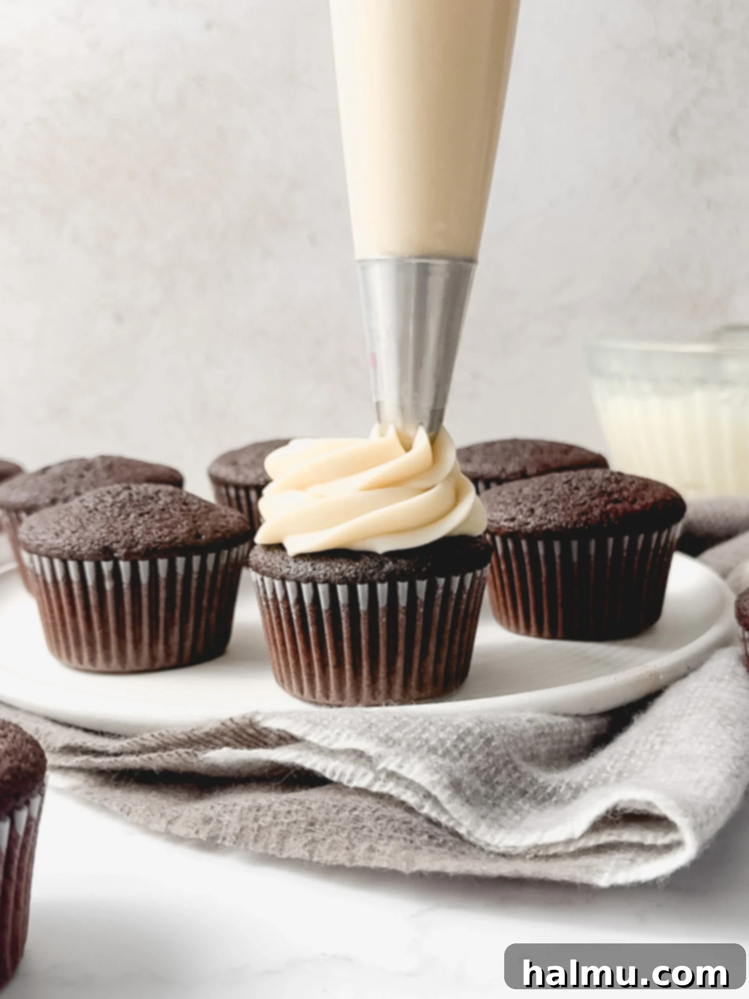 Cupcakes topped with cream cheese frosting